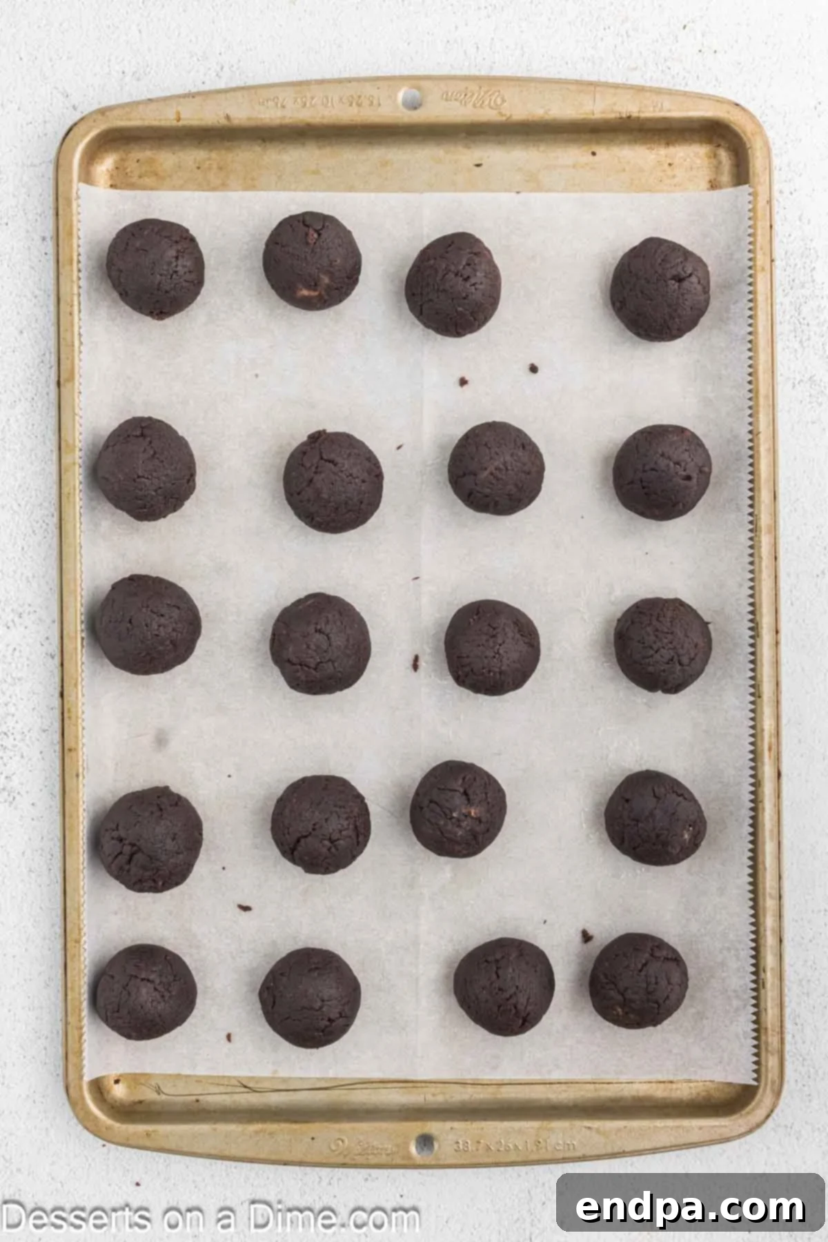 Fudgy Brownie Bonbons 6 Brownie truffles on a baking sheet.