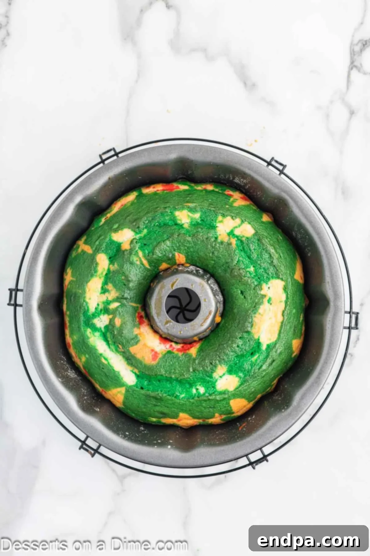 Baked Bundt cake cooling in the pan after coming out of the oven.