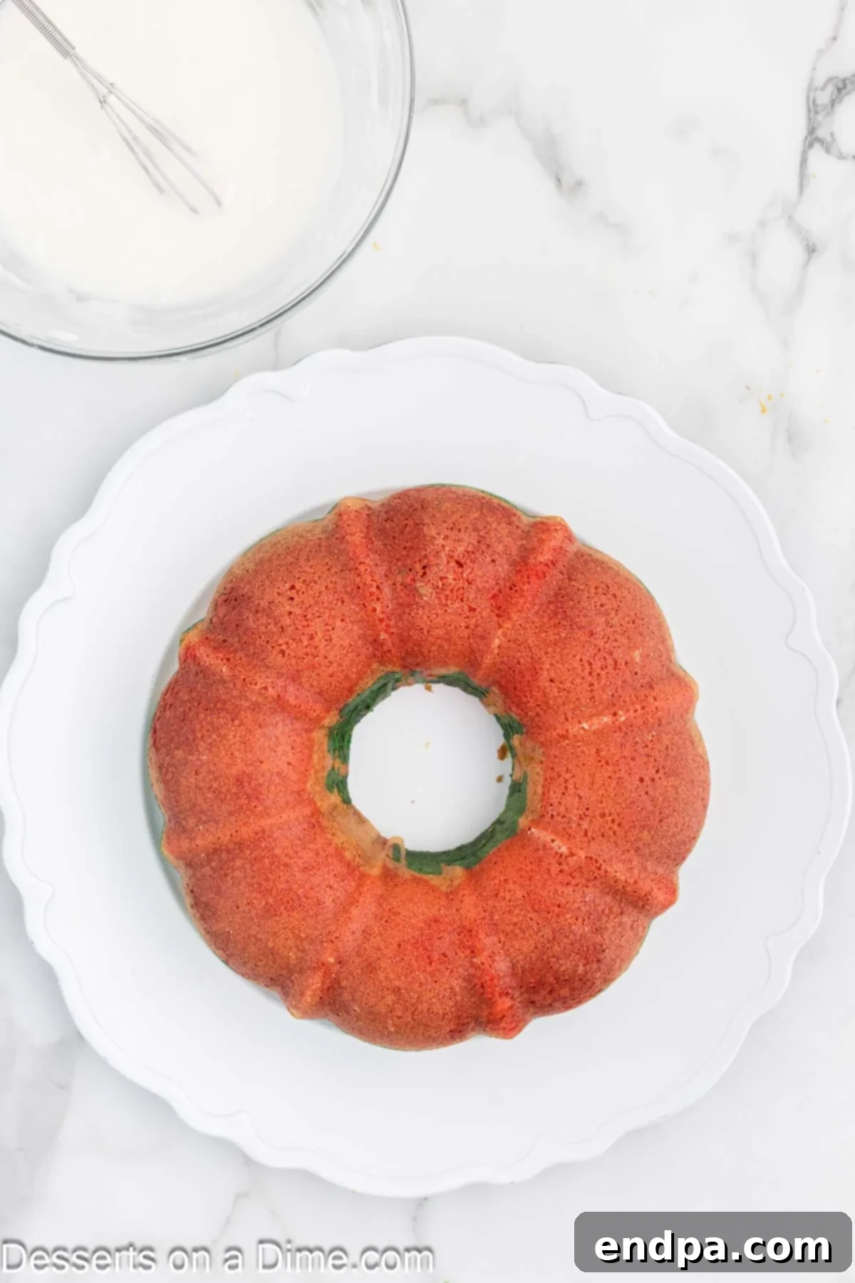 Christmas Bundt cake inverted onto a cooling rack to cool completely.