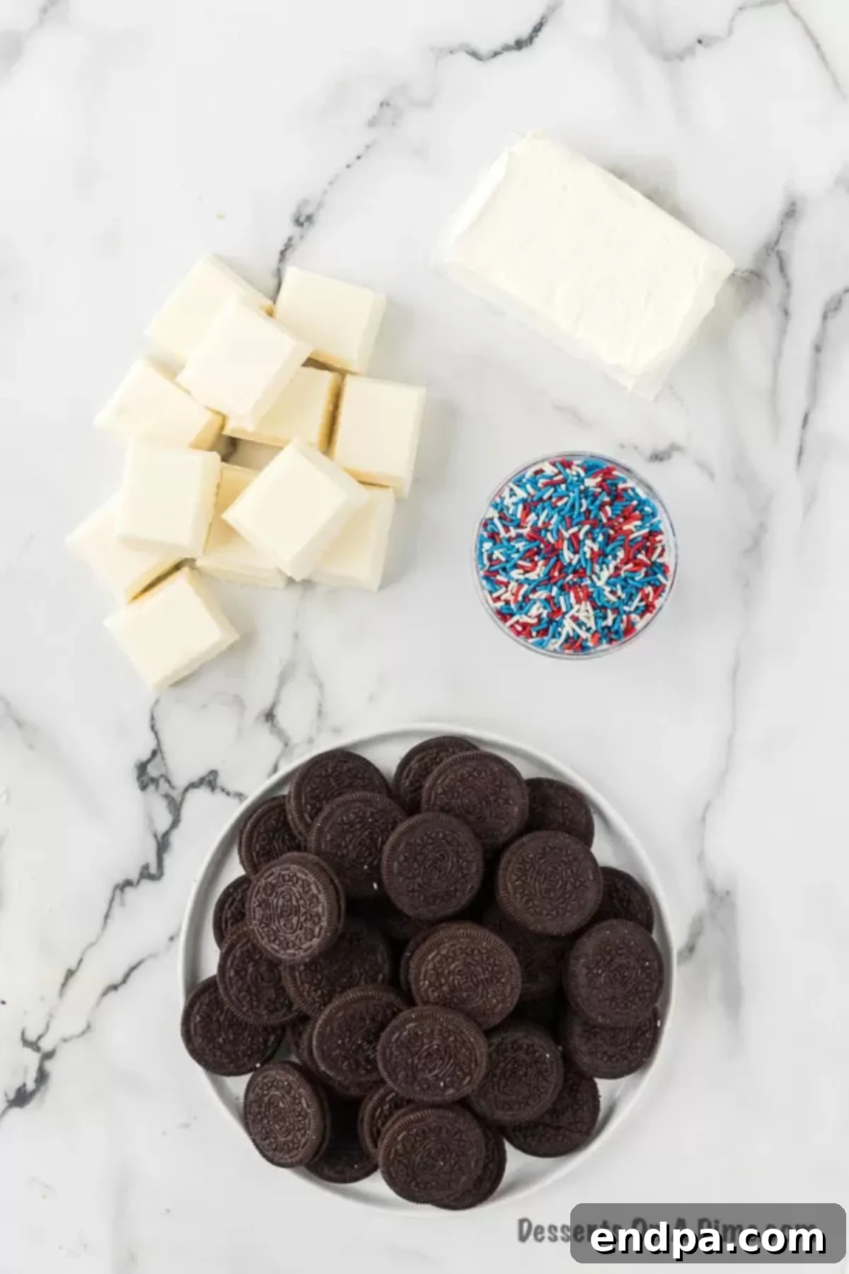Ingredients to make Patriotic Oreo Balls  - cream cheese, oreo cookies, white almond bark, sprinkles. 
