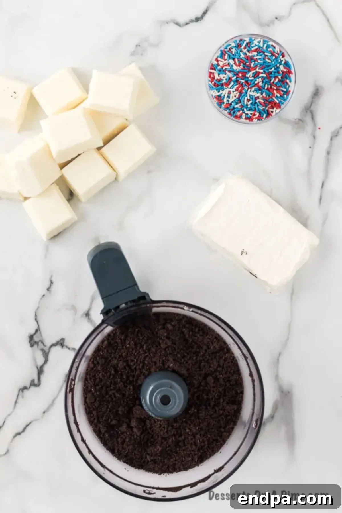 Crushed oreo cookies in food processor.