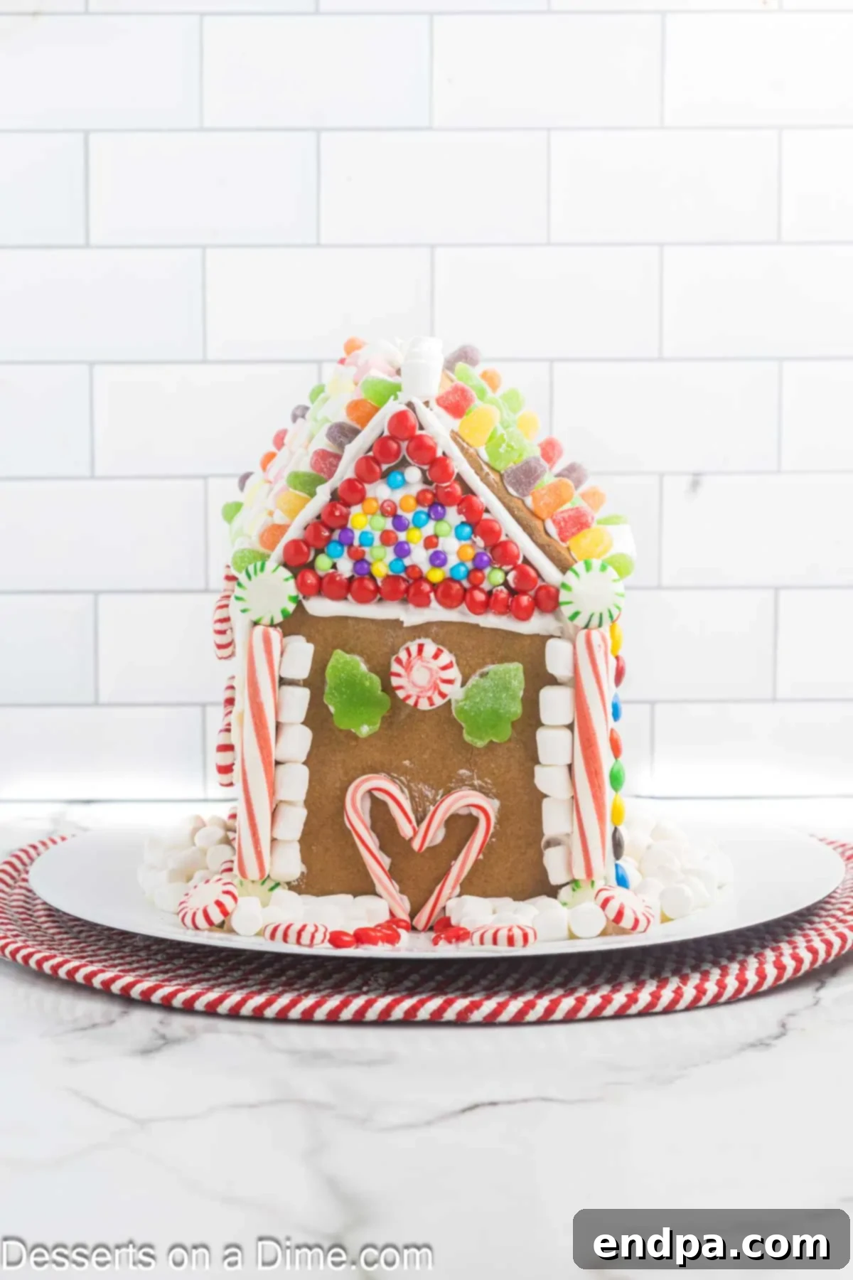 Spiced Sugar Sanctuary 16 A completed gingerbread house, intricately decorated and showcasing festive details, resting on a serving platter as a beautiful holiday centerpiece.