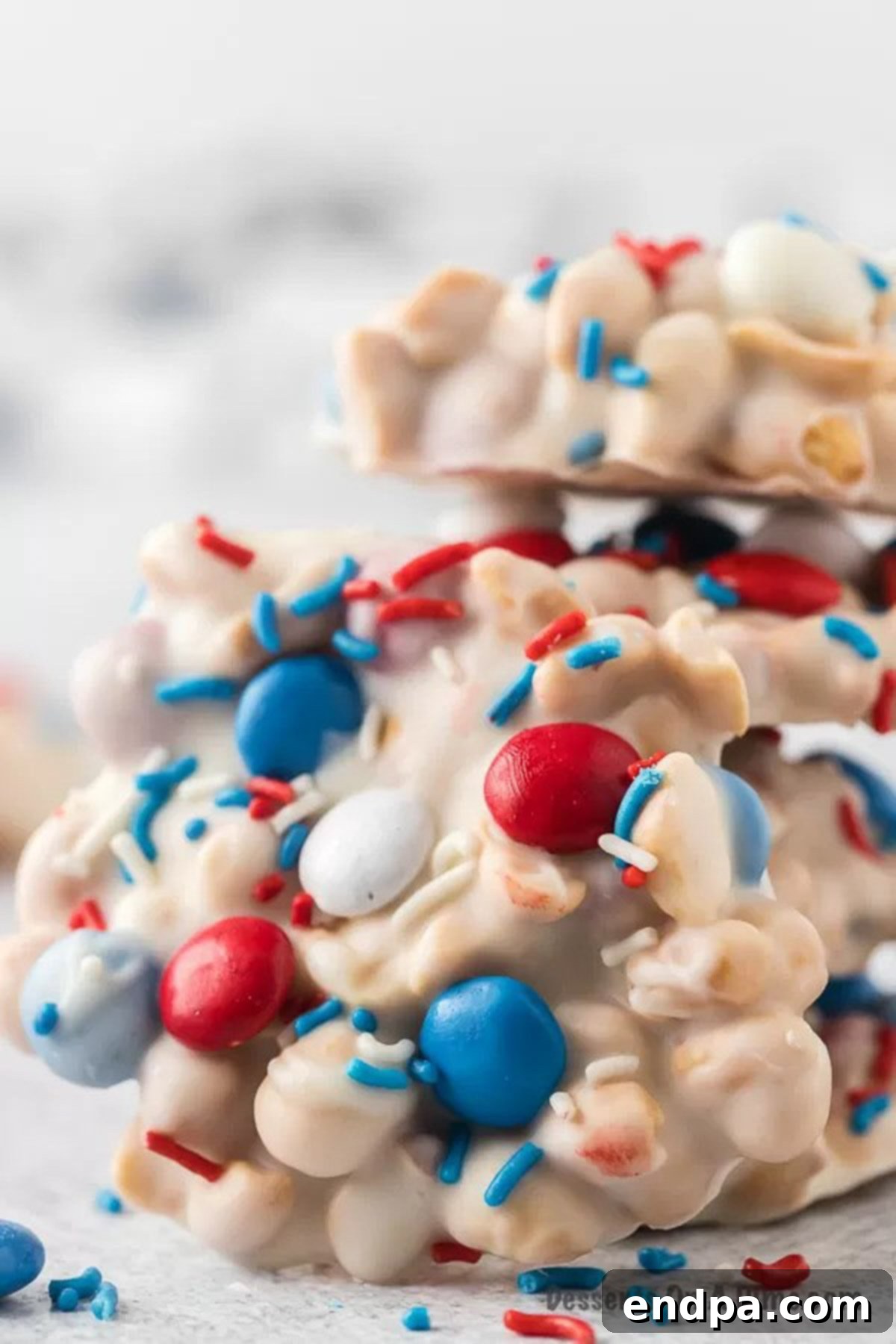 Close up of the crock pot patriotic clusters, showcasing the vibrant red, white, and blue candies and sprinkles