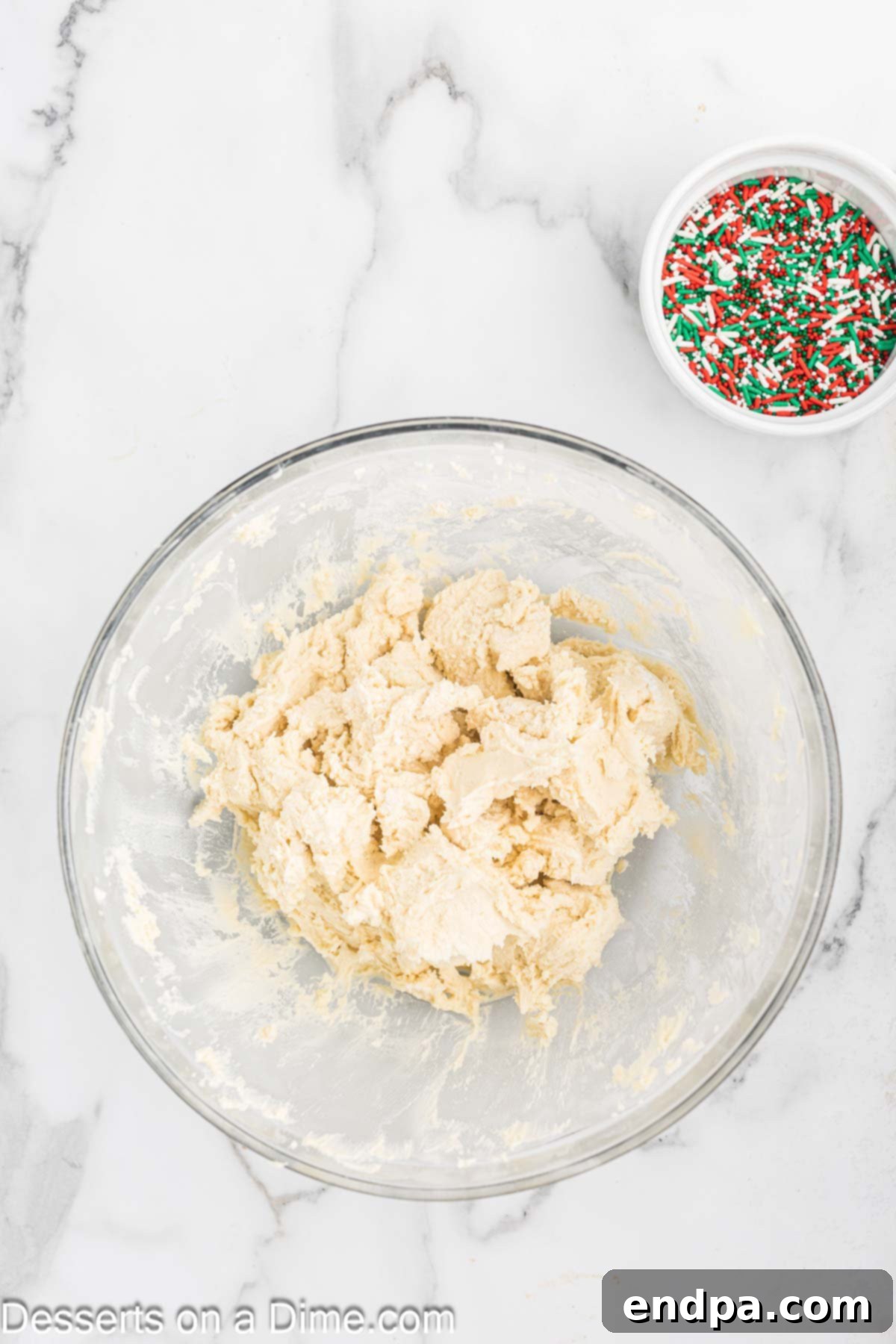 Buttery Christmas Shortbread Delights 5 Dry flour mixture being slowly incorporated into the creamed butter and sugar mixture.