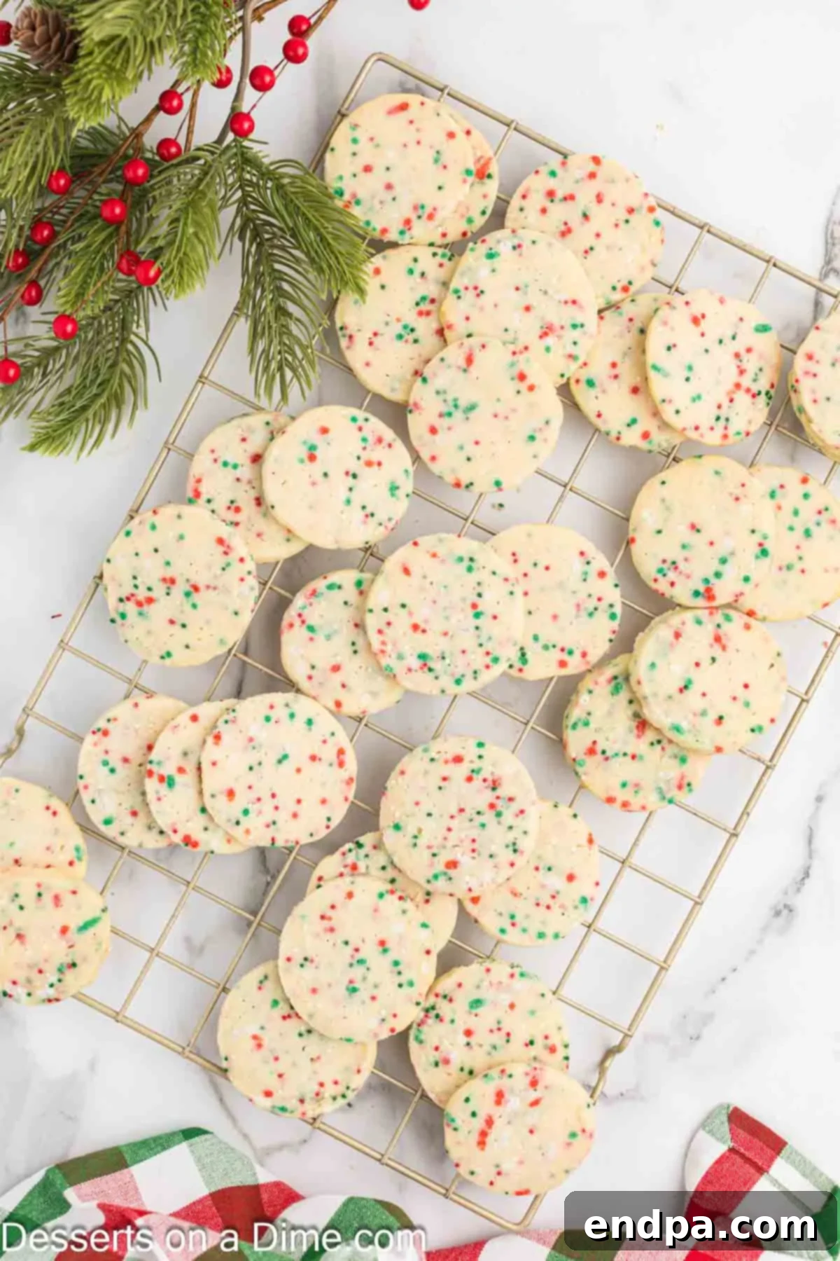 Buttery Christmas Shortbread Delights 9 Baked Shortbread Christmas Cookies cooling on a wire rack.