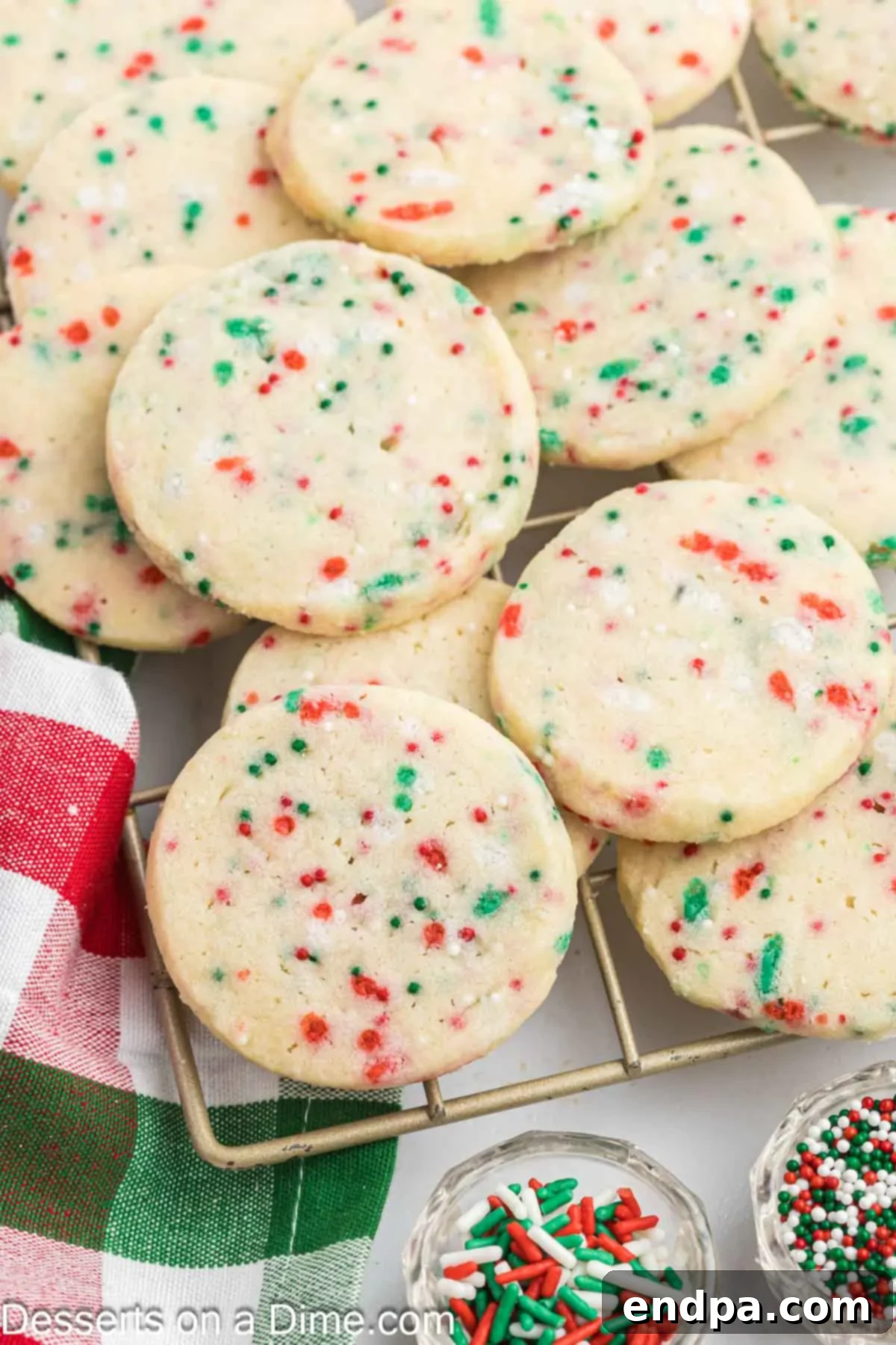 Buttery Christmas Shortbread Delights 10 Beautifully arranged Shortbread Christmas Cookies cooling on a wire rack, ready to be enjoyed.