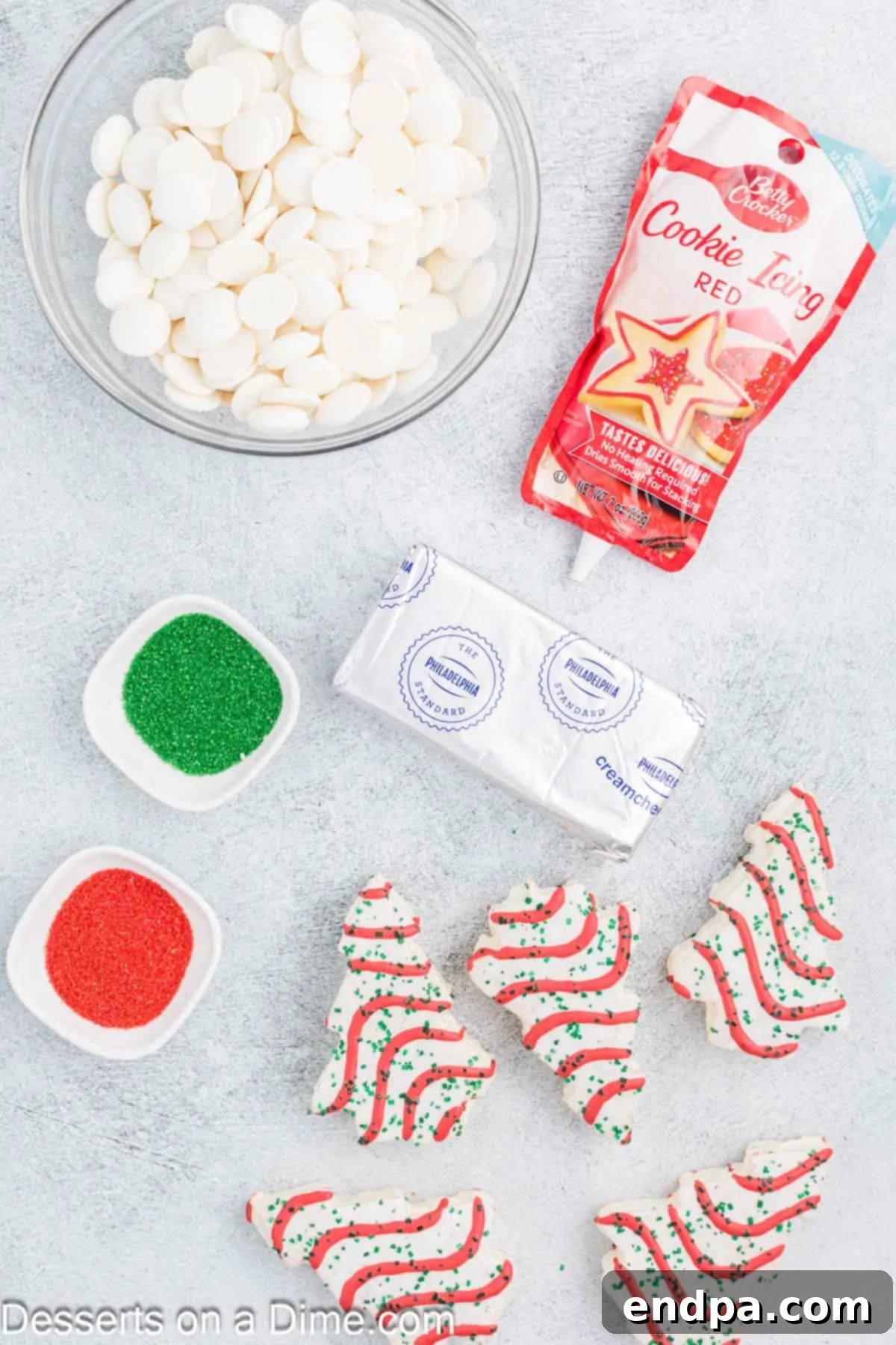 Ingredients for Little Debbie Cake Balls - Little Debbie Christmas tree cakes, cream cheese, white candy melts, red cookie icing, red and green sanding sugar.