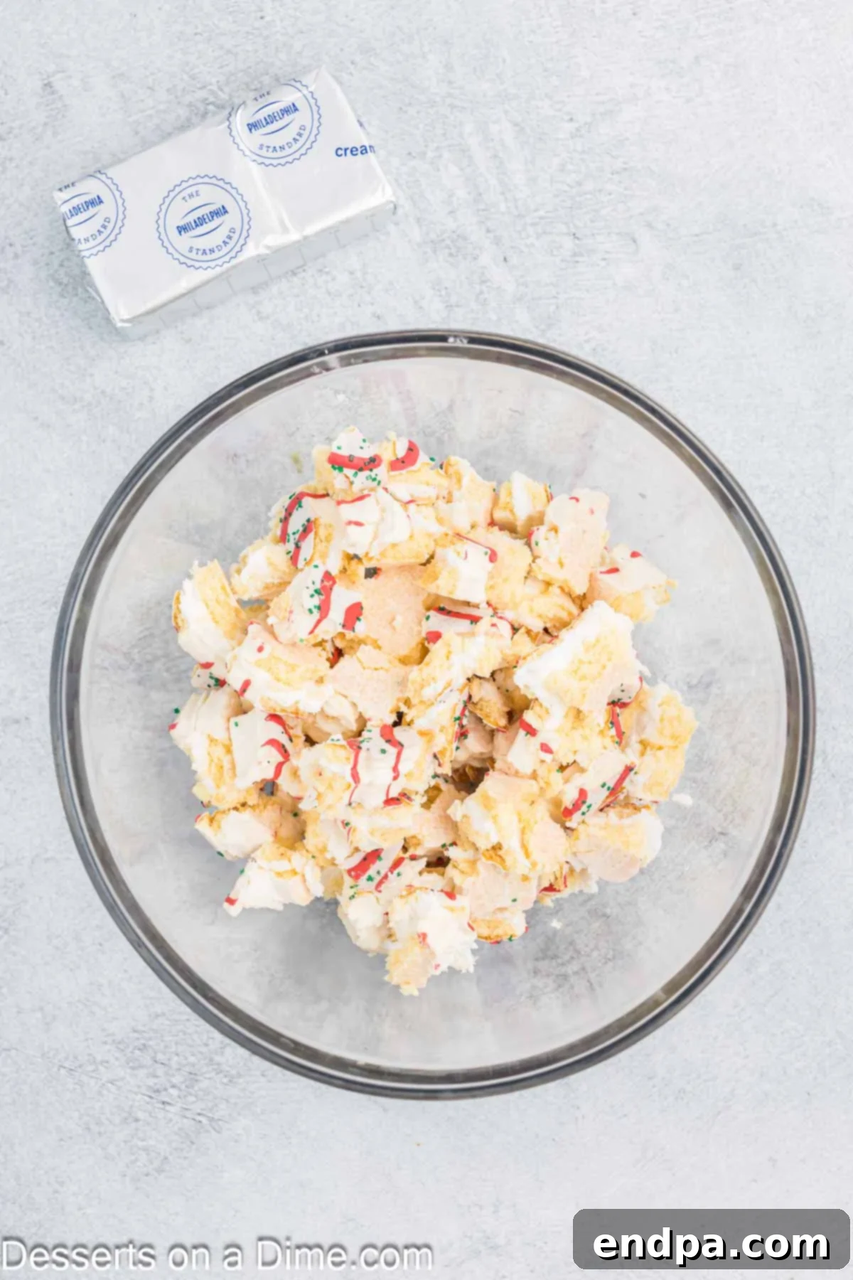Little Debbie Christmas tree cake crumbled in a bowl.