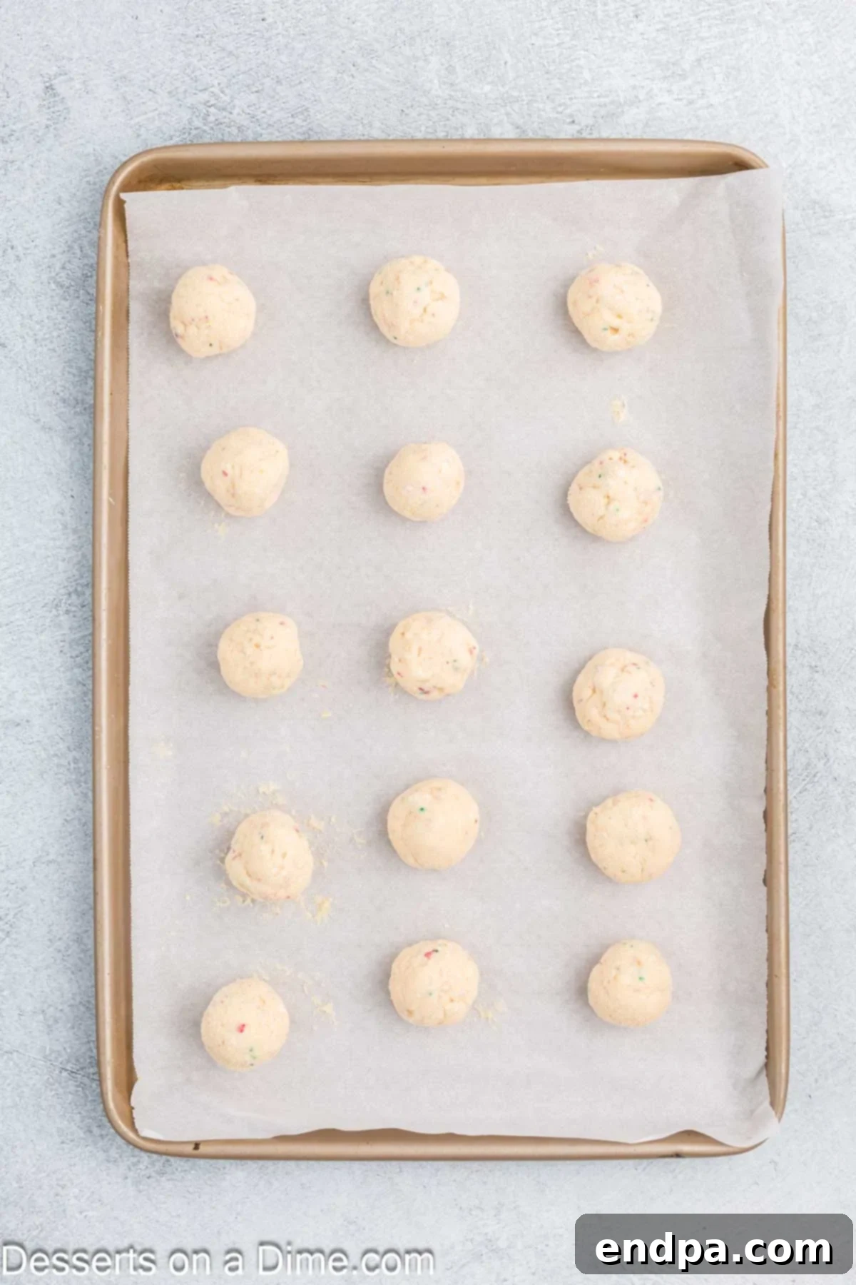 Cake balls on baking sheet lined with wax paper.