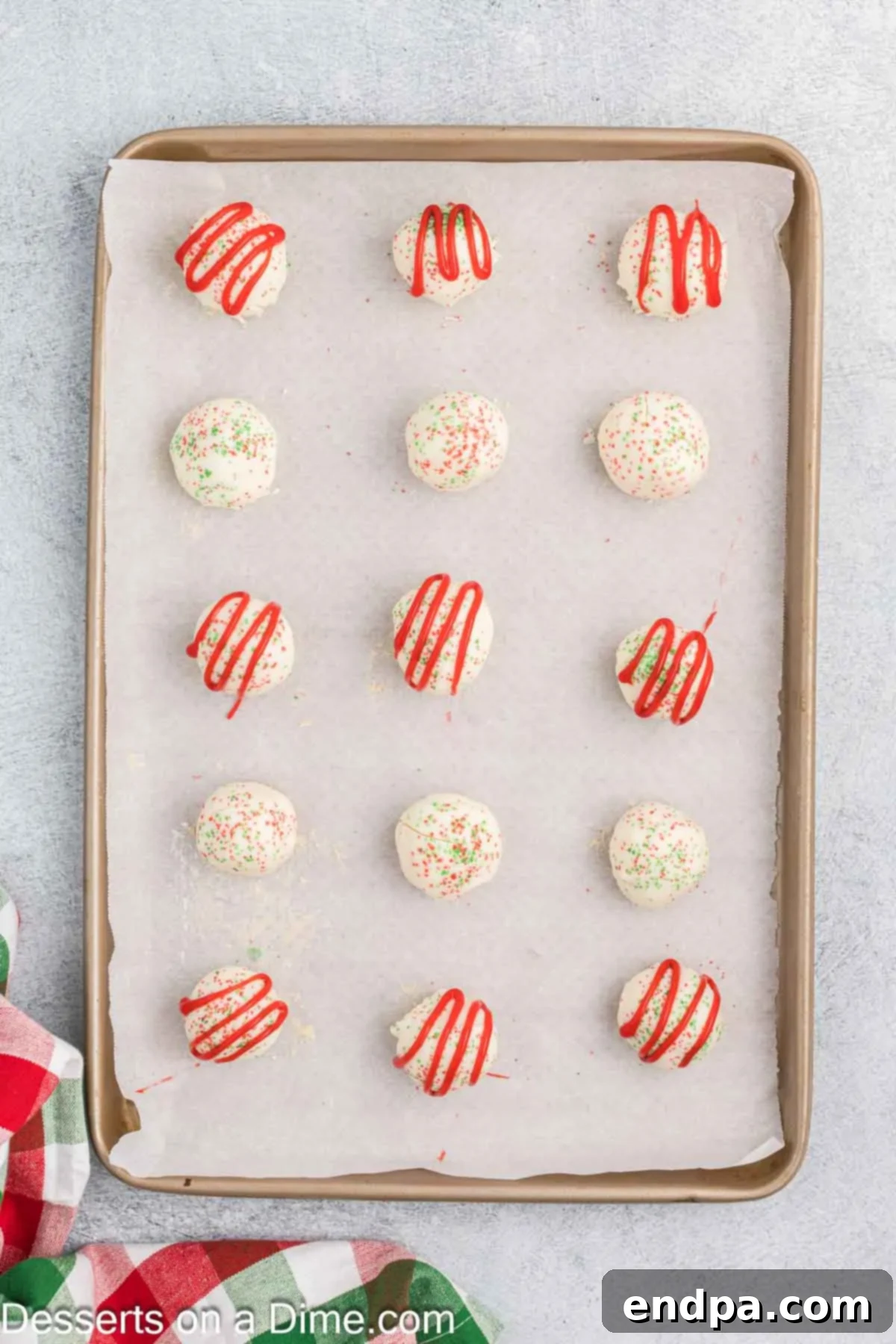 Red icing drizzled on cake balls.