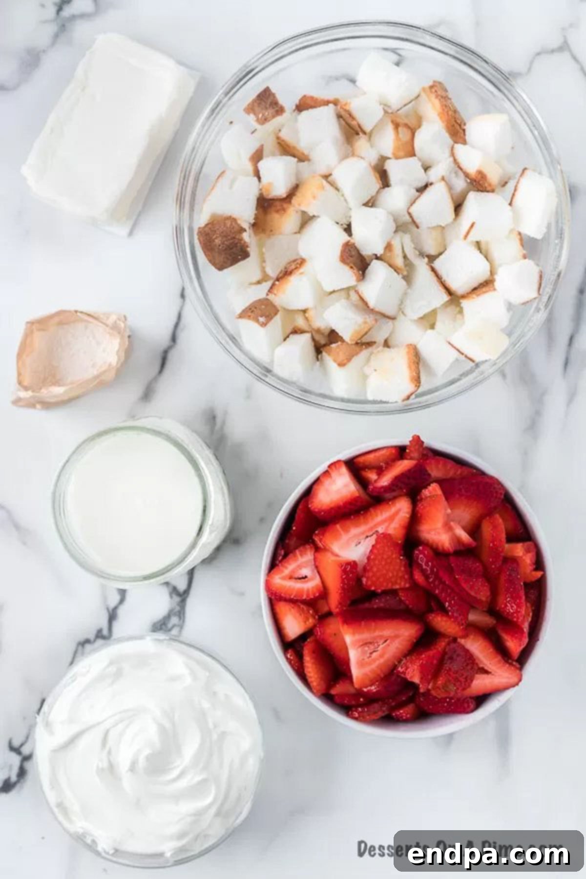 Ingredients for trifle recipe - angel food cake, pudding, milk, strawberries, cream cheese. 