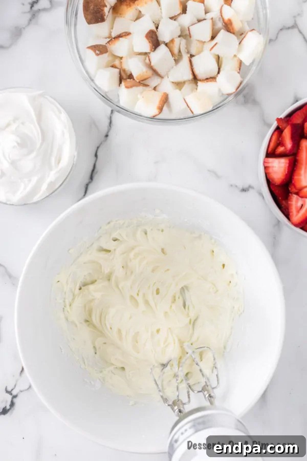 Separate mixing bowl with cream cheese.