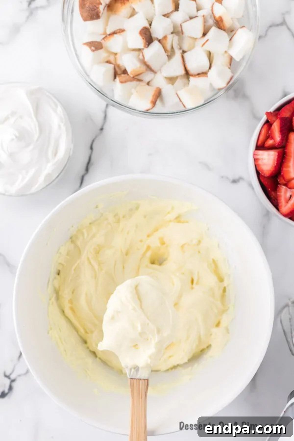 Powdered sugar added into cream cheese mixture. 