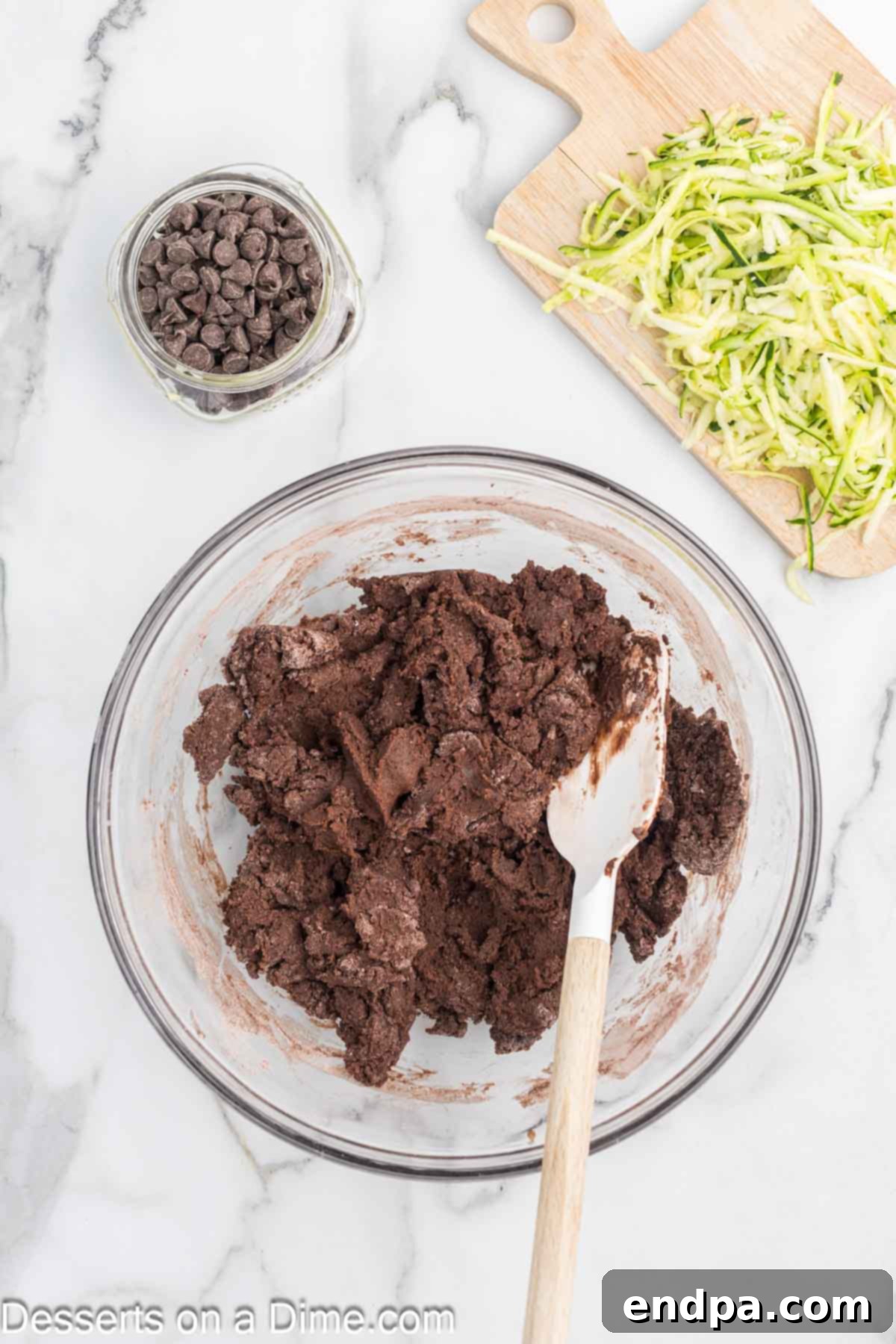 Fudgy Chocolate Zucchini Bread 4 Mixing bowl with wet and dry ingredients combined together, showing the batter's consistency.