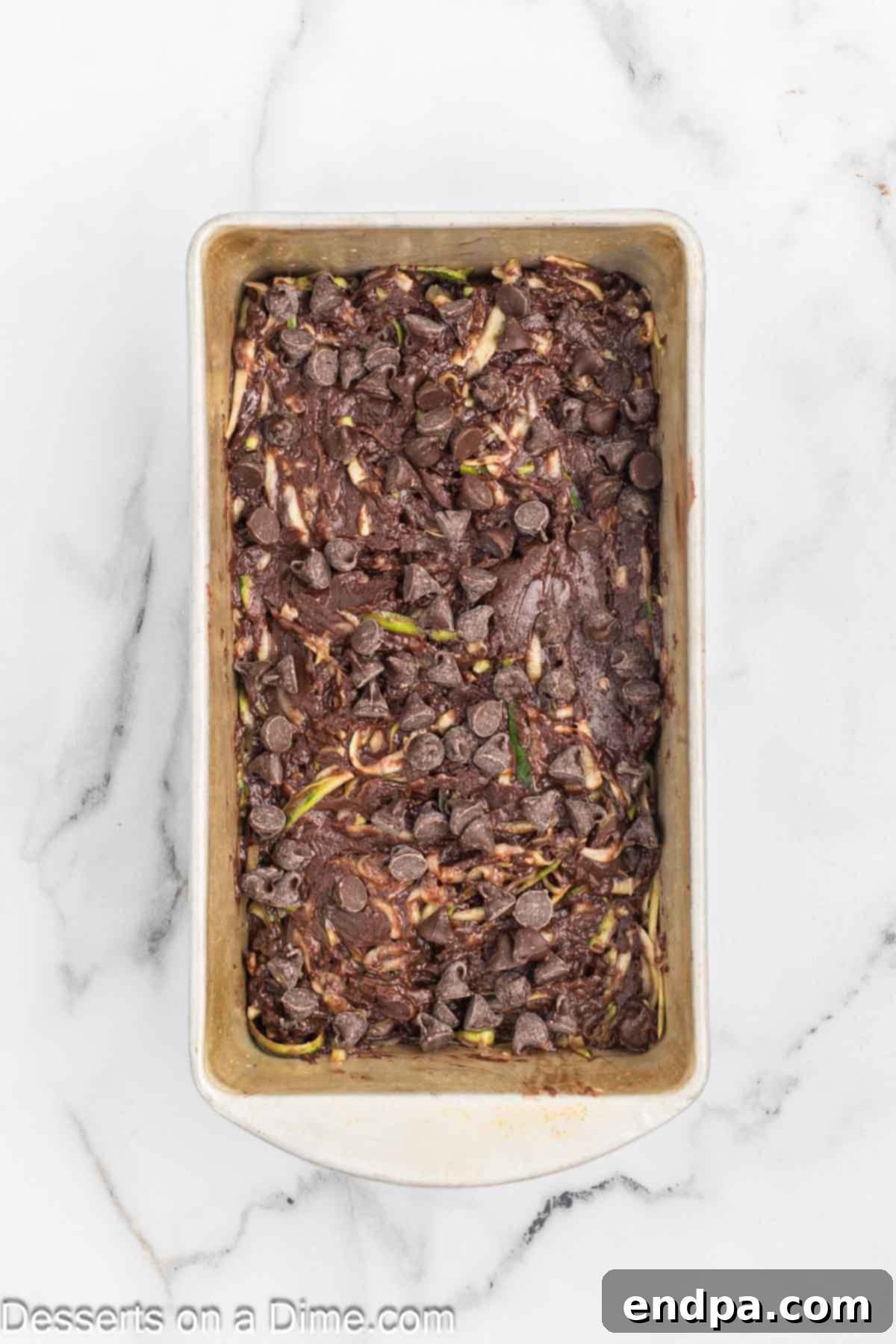 Fudgy Chocolate Zucchini Bread 7 Remaining chocolate chips sprinkled over the top of the bread batter before baking.