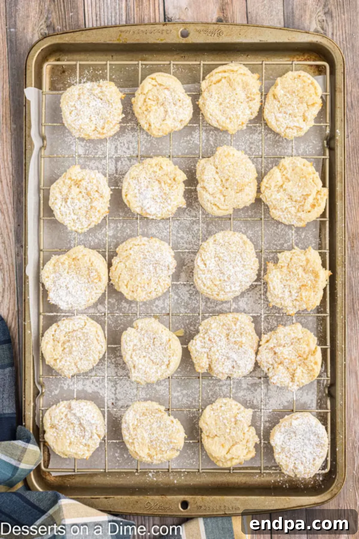 Cooling cream cheese cake mix cookies on a wire rack after baking.