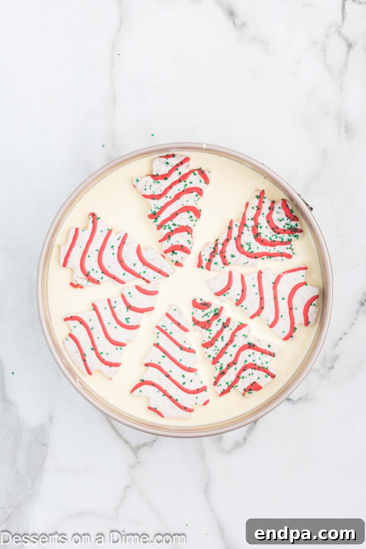 Little Debbie Trees placed on top of cheesecake batter. 