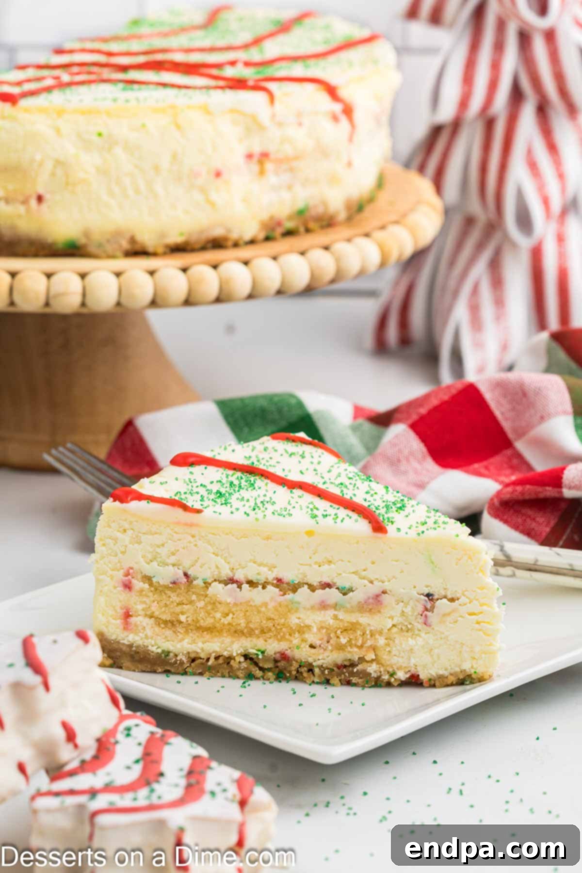 Little Debbie Christmas Tree Cheesecake sliced and served on a plate. 