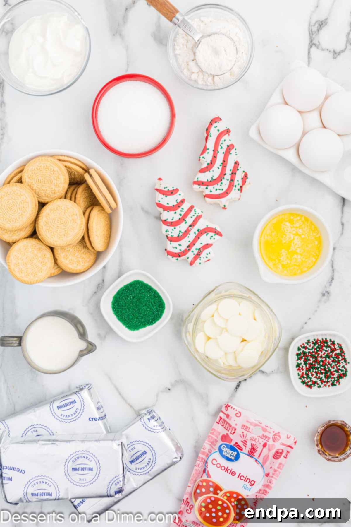 Ingredients for Little Debbie Cheesecake - Golden Oreo Cookies, butter, Christmas sprinkles, cream cheese, sugar, vanilla, sour cream, eggs, Christmas tree cakes, white baking chocolate, heavy whipping cream. 