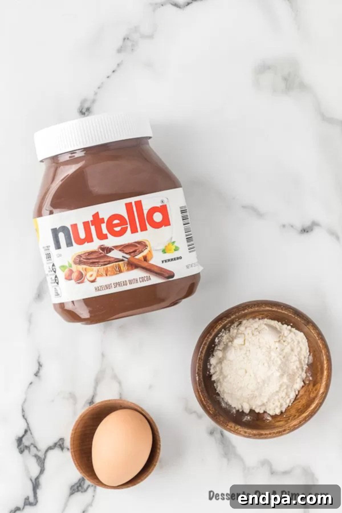 Ingredients for Nutella mug cake recipe: Nutella, egg, and flour