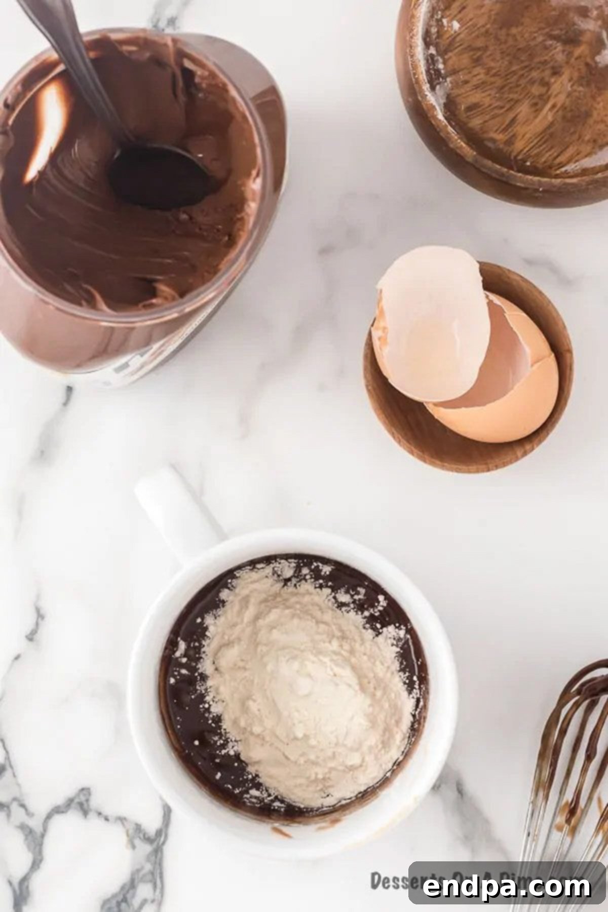 Flour being gently folded into the Nutella and egg mixture