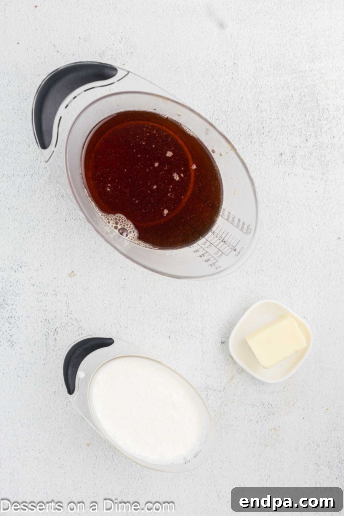 Creamy Maple Fudge 3 Ingredients for Maple Fudge laid out: pure maple syrup, heavy cream, and unsalted butter.