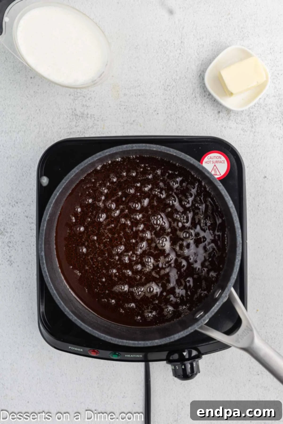 Creamy Maple Fudge 4 Pure maple syrup simmering in a saucepan over medium heat.