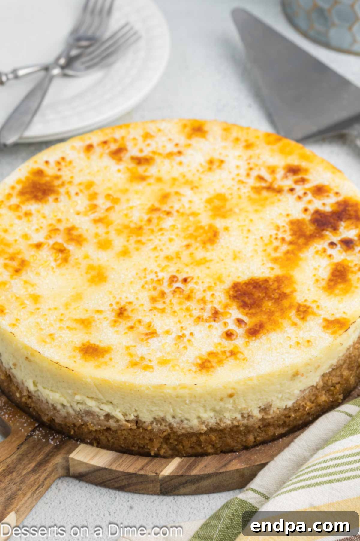 Crispy Caramel Cheesecake 14 A stunning Cheesecake Brulee with a perfectly torched, golden caramelized sugar topping, ready to be served and enjoyed.