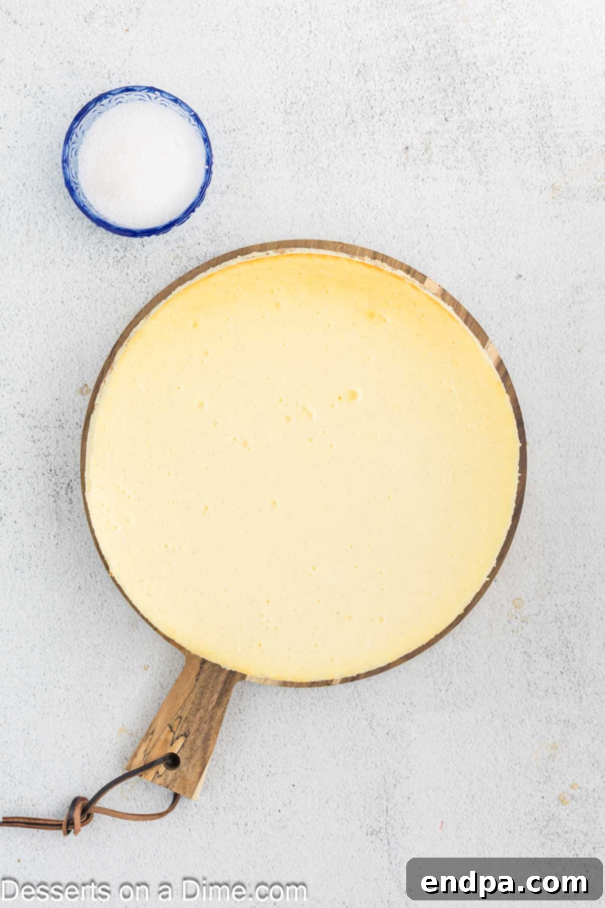Crispy Caramel Cheesecake 10 A perfectly baked and chilled Cheesecake, still in the springform pan, sitting on a wire rack.