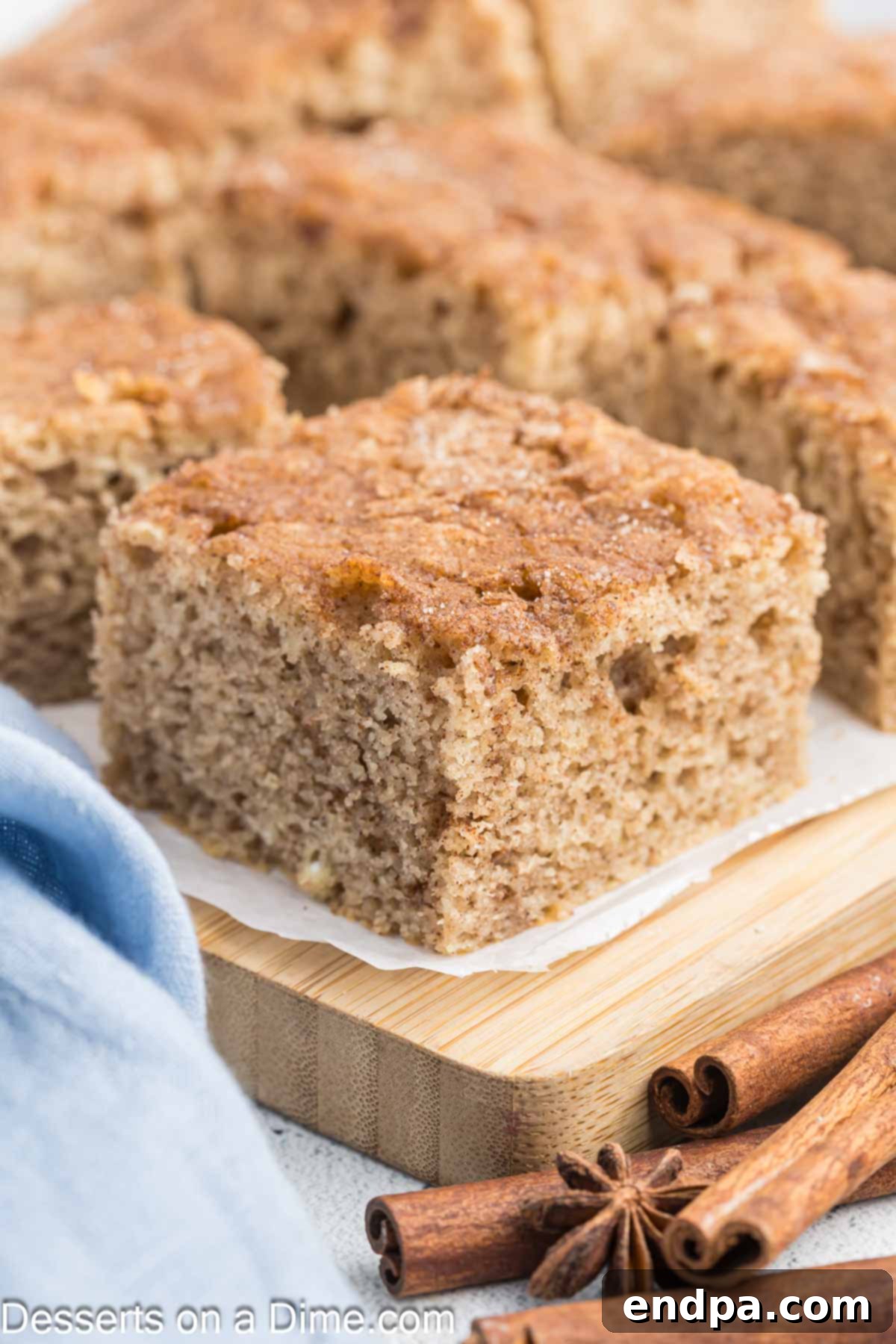 Golden Spiced Churro Cake 2 Sliced Churro cake ready to be served, showcasing its cinnamon sugar topping and moist texture.