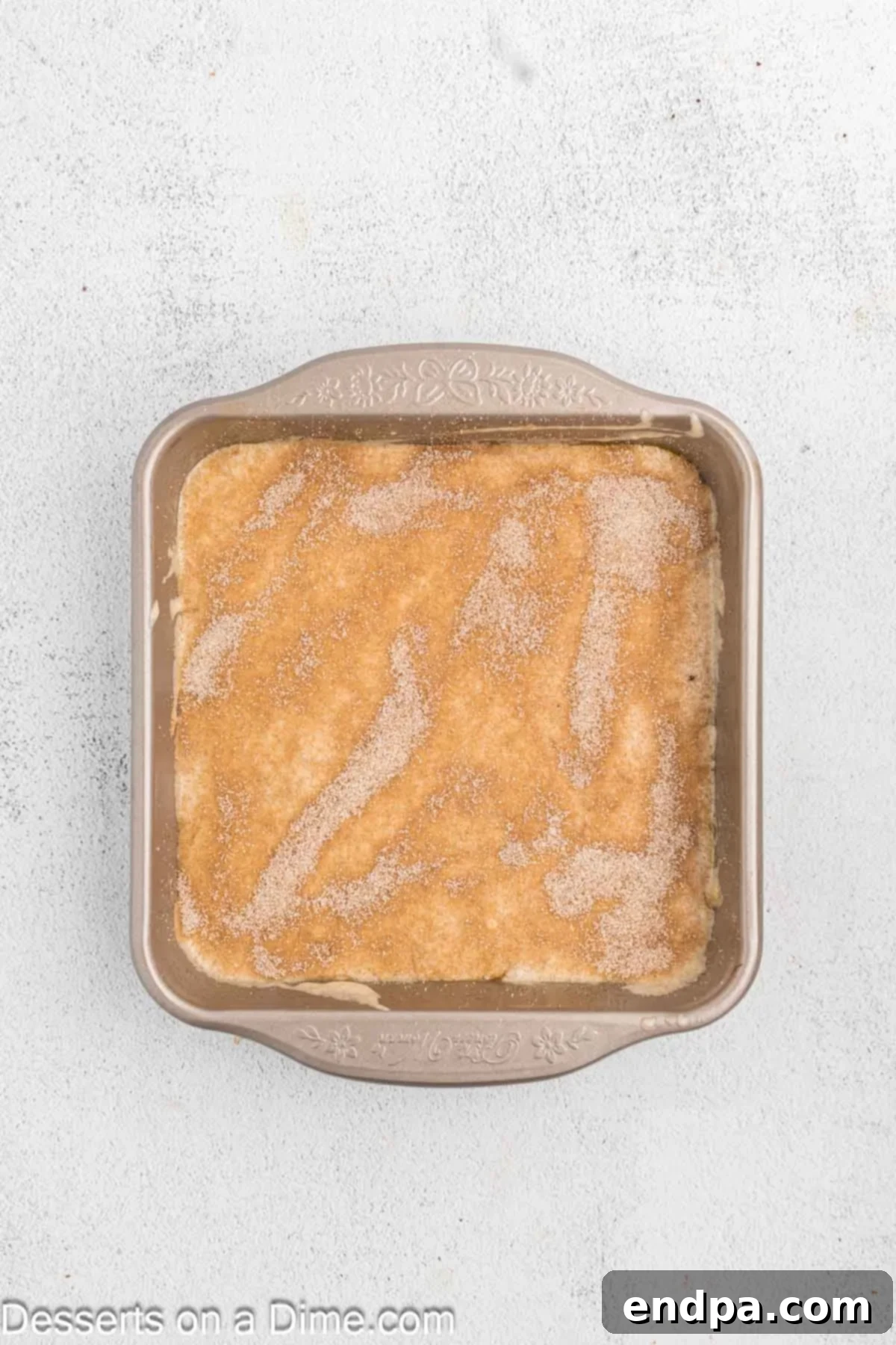 Golden Spiced Churro Cake 12 Remaining cinnamon sugar mixture sprinkled on top of the final cake batter layer.