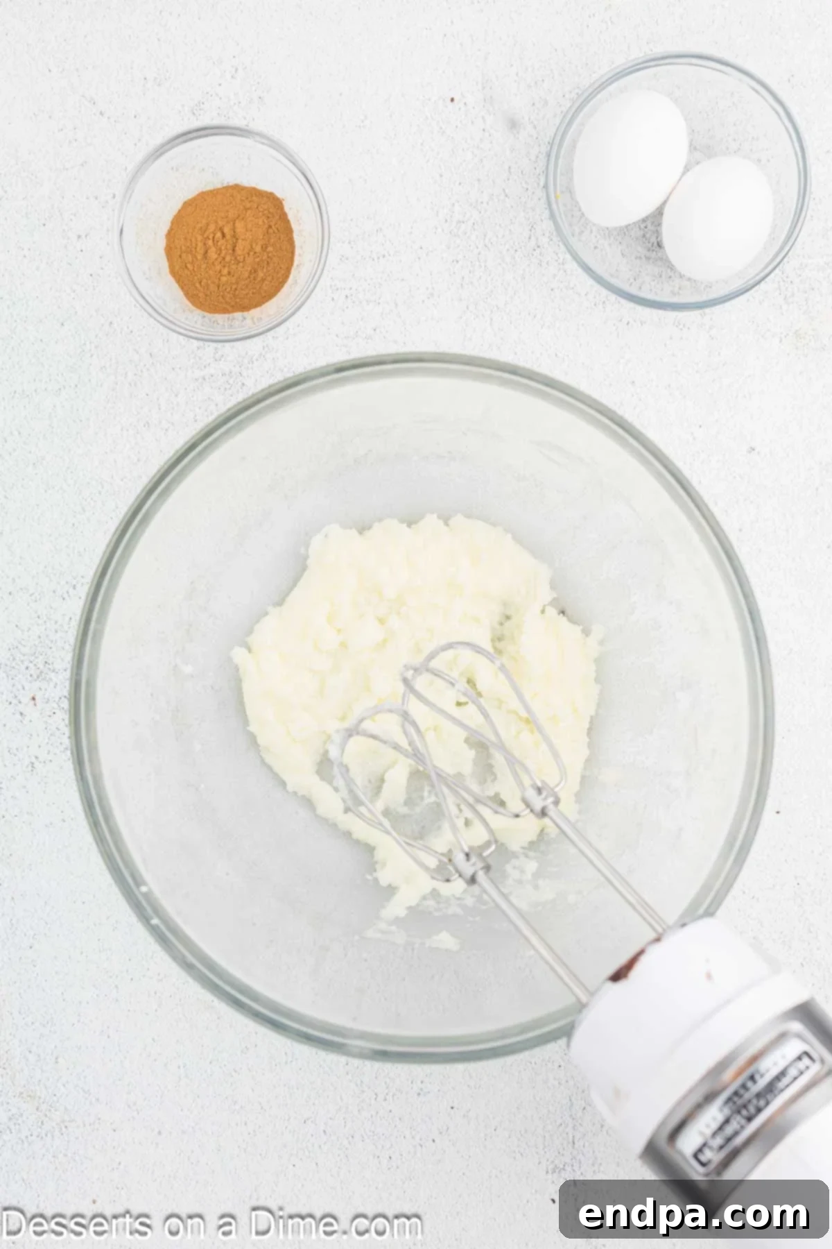 Golden Spiced Churro Cake 4 Butter and granulated sugar being creamed together in a mixing bowl.