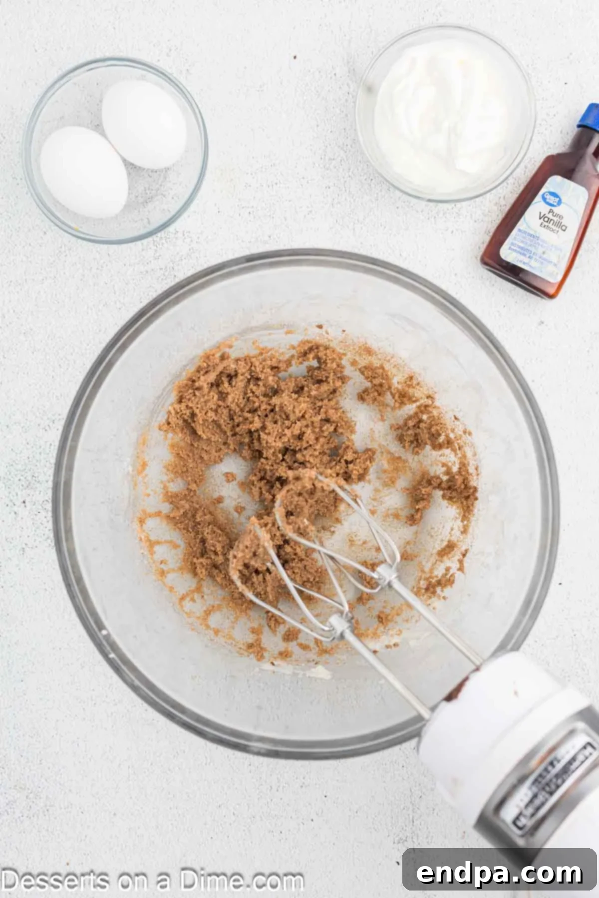 Golden Spiced Churro Cake 5 Ground cinnamon being mixed into the creamed butter and sugar mixture.