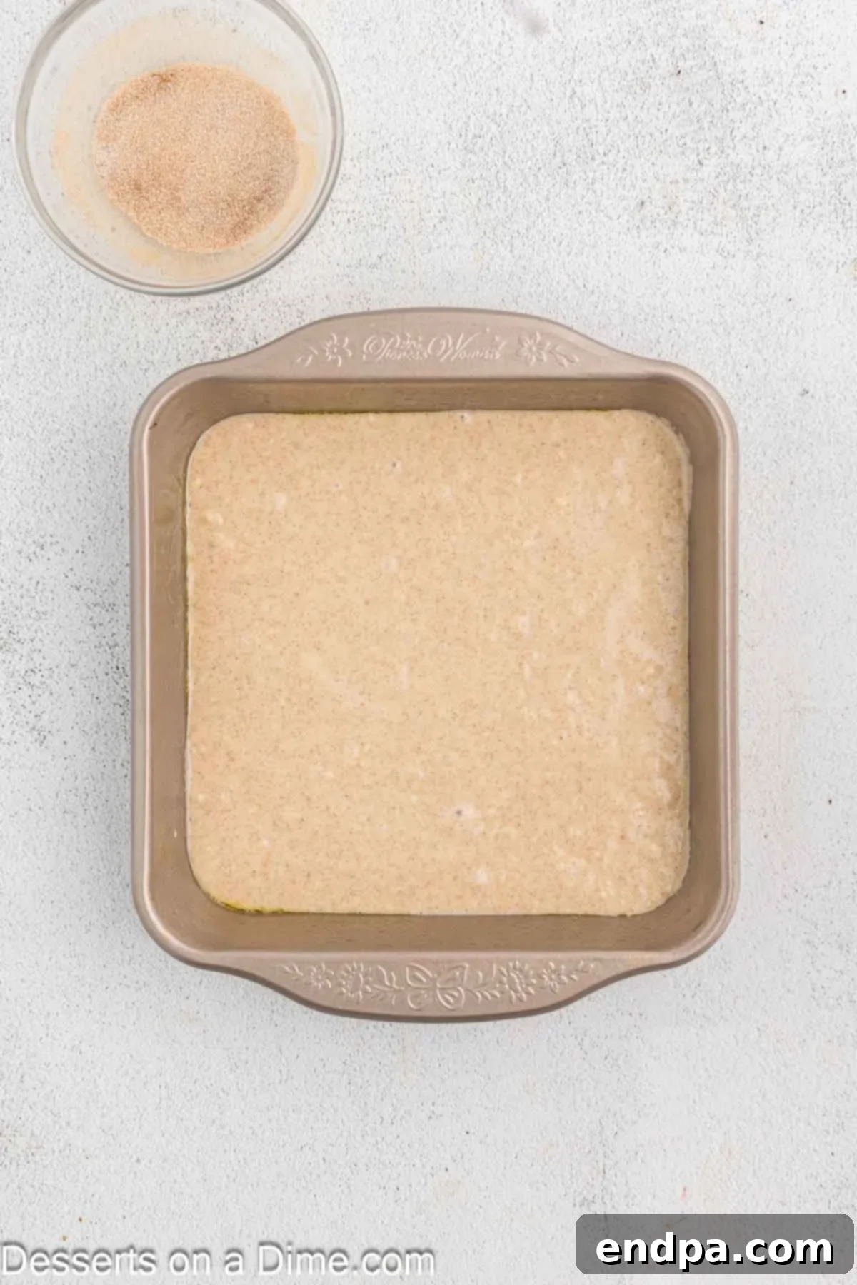 Golden Spiced Churro Cake 9 Half of the cake batter poured into the prepared baking pan.