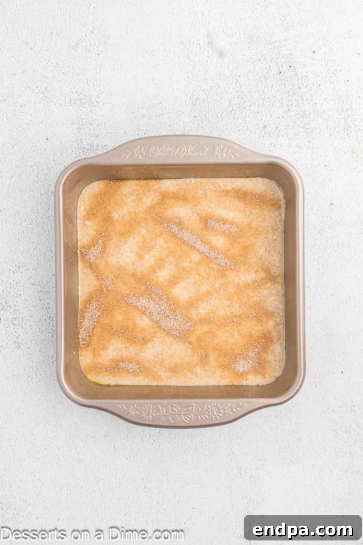 Golden Spiced Churro Cake 10 Cinnamon sugar mixture sprinkled over the first layer of cake batter.