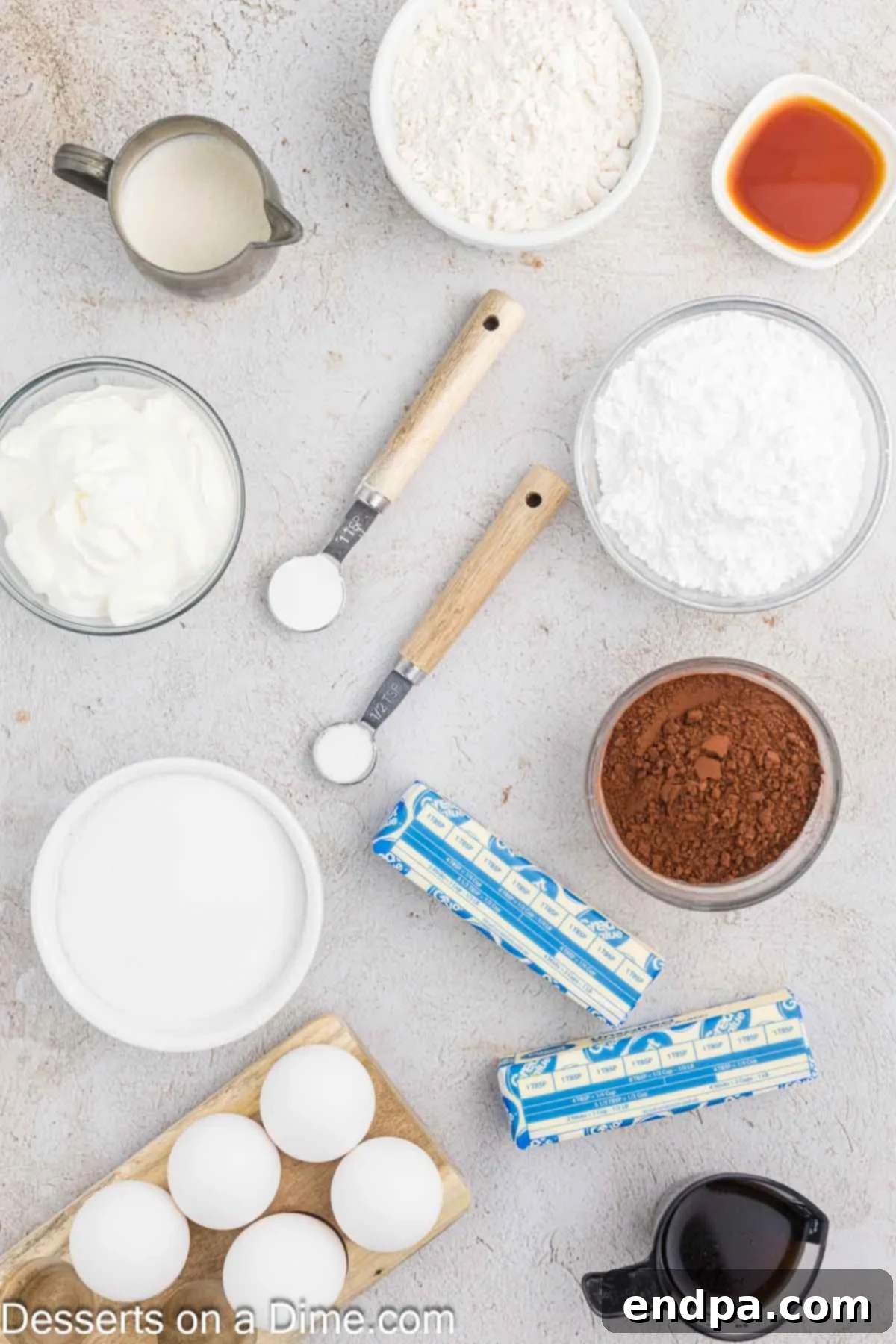 Velvet Chocolate Loaf 3 Essential ingredients for Chocolate Pound Cake laid out: flour, cocoa powder, butter, eggs, vanilla extract, liquid coffee, and sour cream.