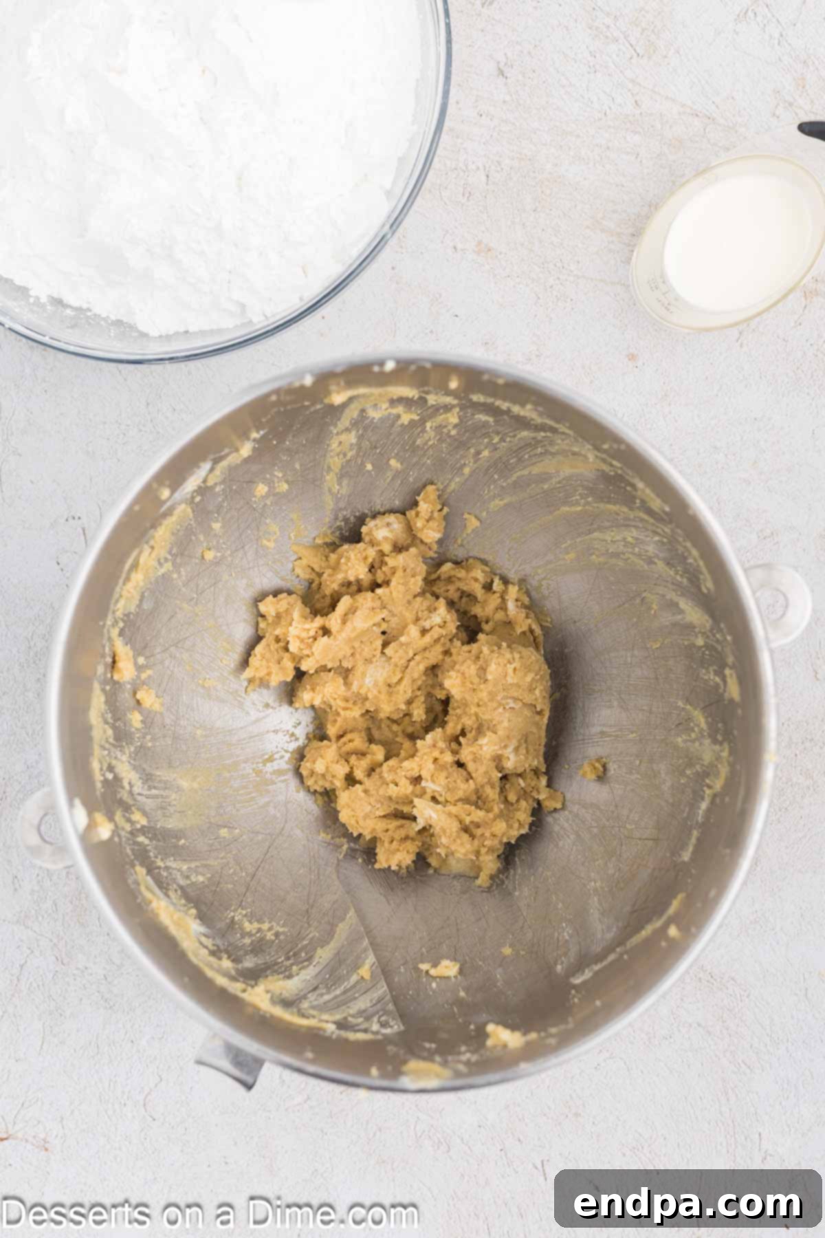 Golden Brown Sugar Buttercream 5 Creamy mixture of butter, vanilla, and brown sugar after initial mixing, showing a smooth, light brown color.