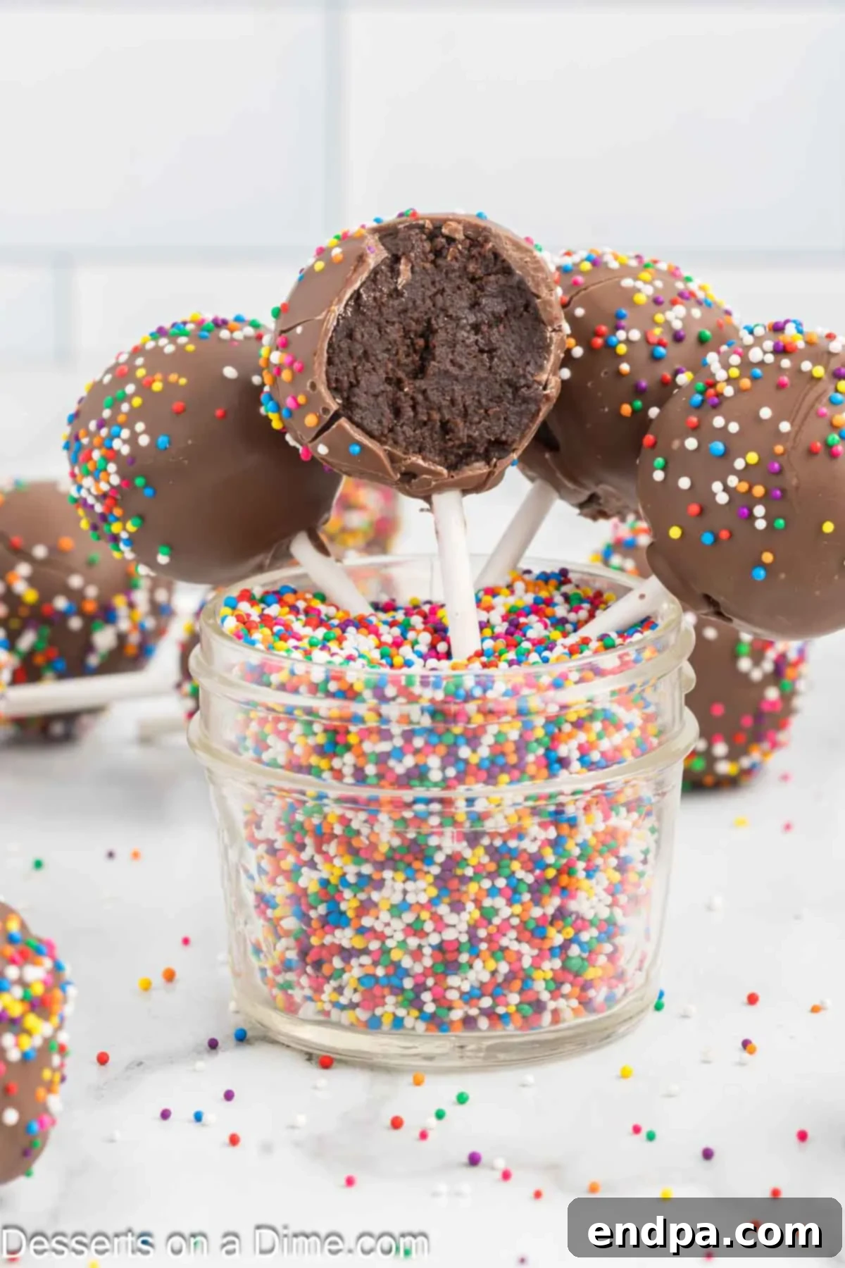 Bite Sized Chocolate Bliss 2 Chocolate Cake Pops beautifully arranged in a clear jar with colorful sprinkles, ready for a party.