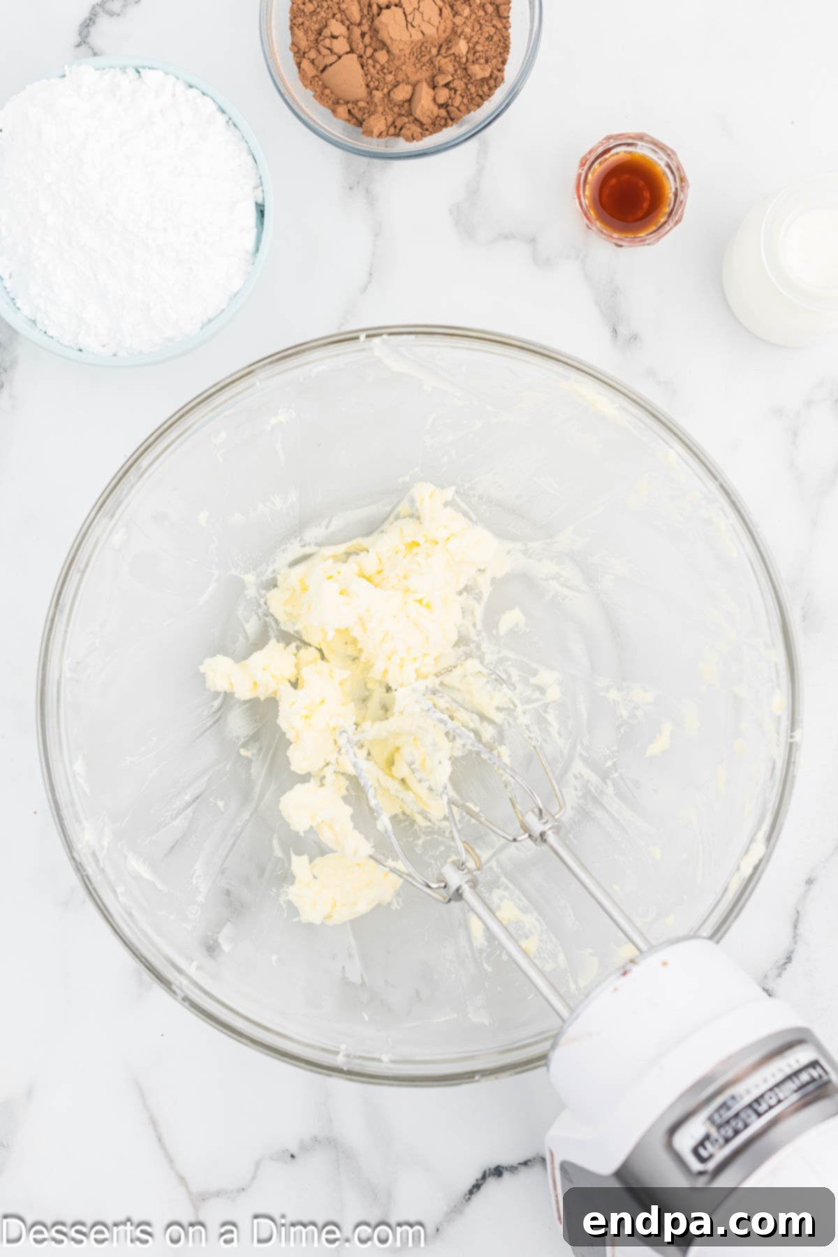 Bite Sized Chocolate Bliss 7 Softened unsalted butter being beaten in a mixing bowl until light and fluffy using a stand mixer.