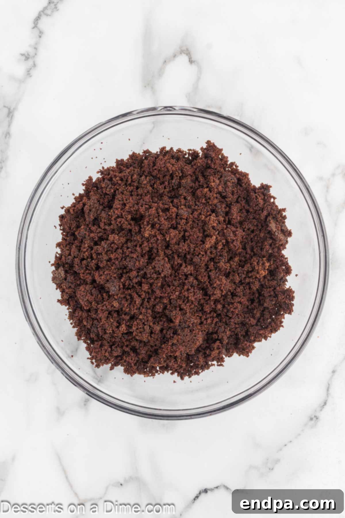 Bite Sized Chocolate Bliss 9 Crumpled chocolate cake in a large mixing bowl, ready to be combined with frosting.