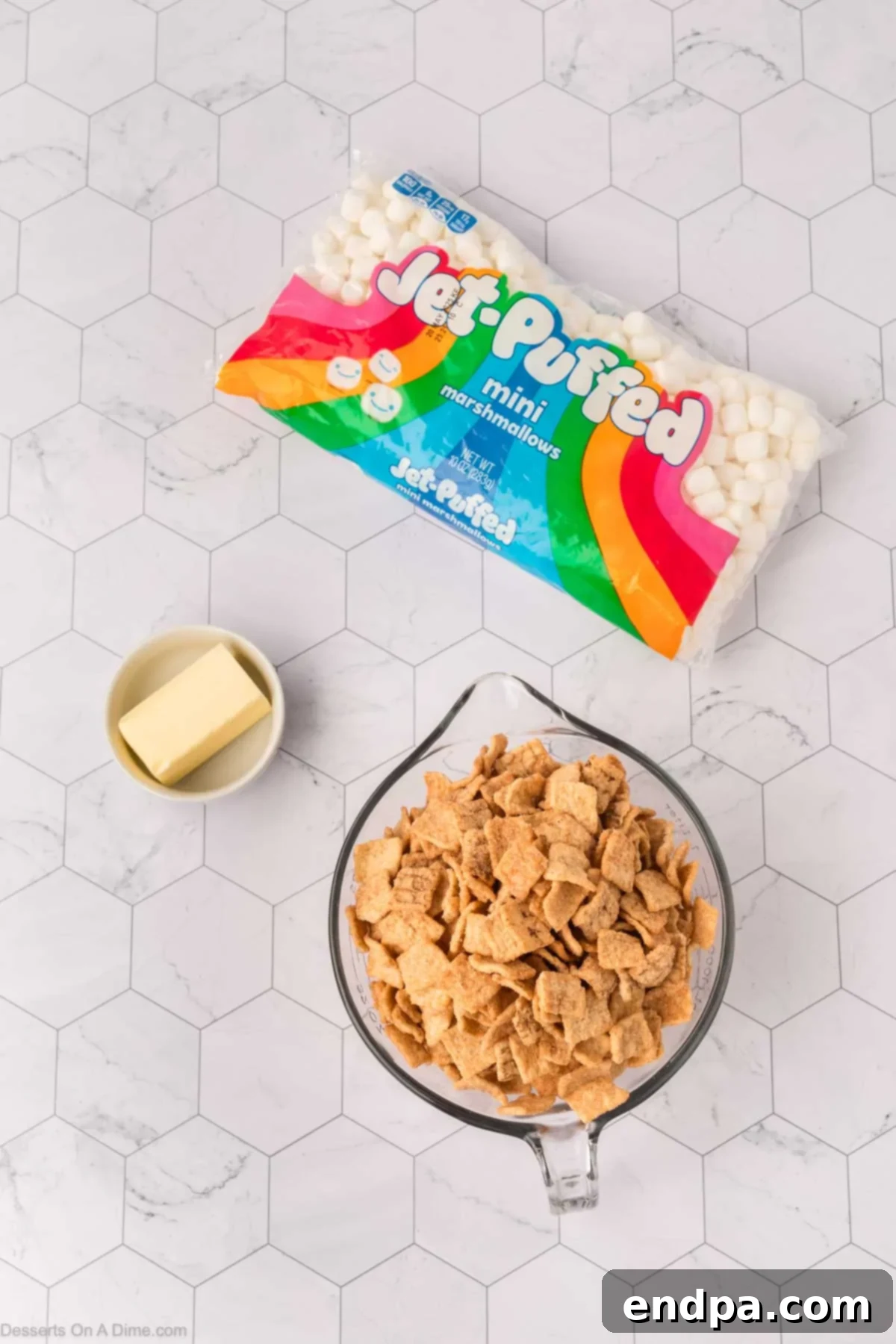 Ingredients for Cinnamon Toast Crunch Bars - cinnamon toast crunch cereal, butter, mini marshmallows displayed clearly.