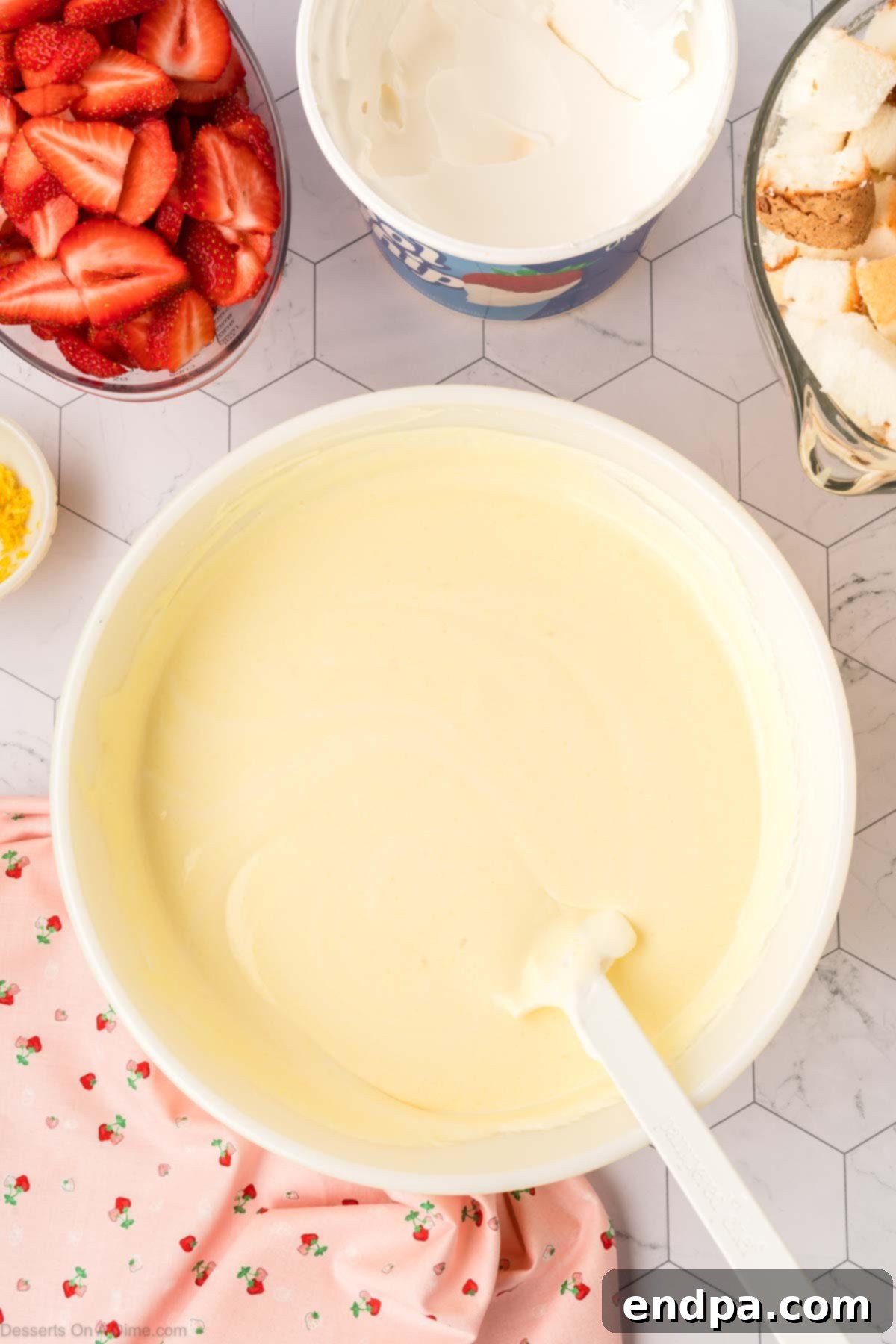 Smooth, light yellow pudding mixture ready for assembly.