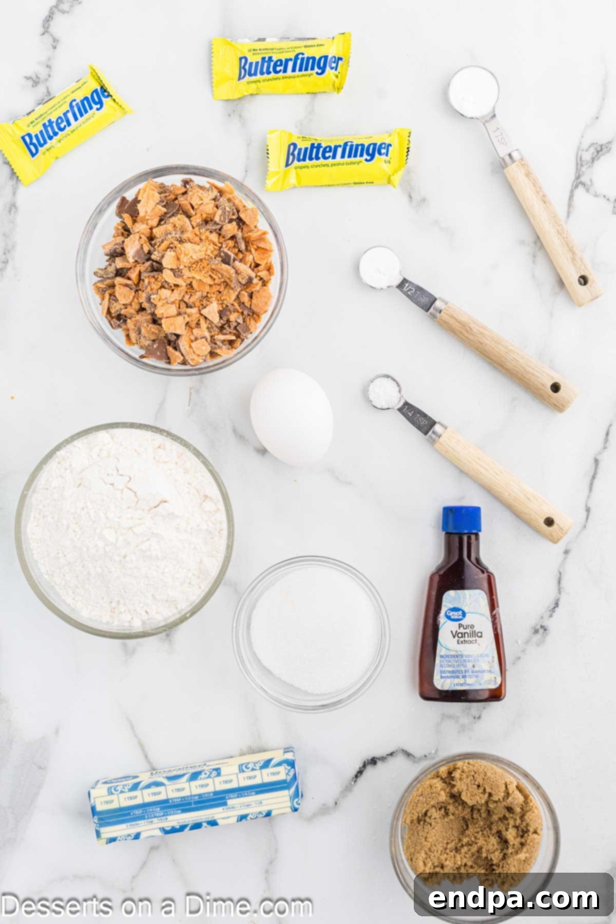 Butterfinger Cookie ingredients - flour, brown sugar, eggs, vanilla, butter, baking soda, Butterfinger candy bars.
