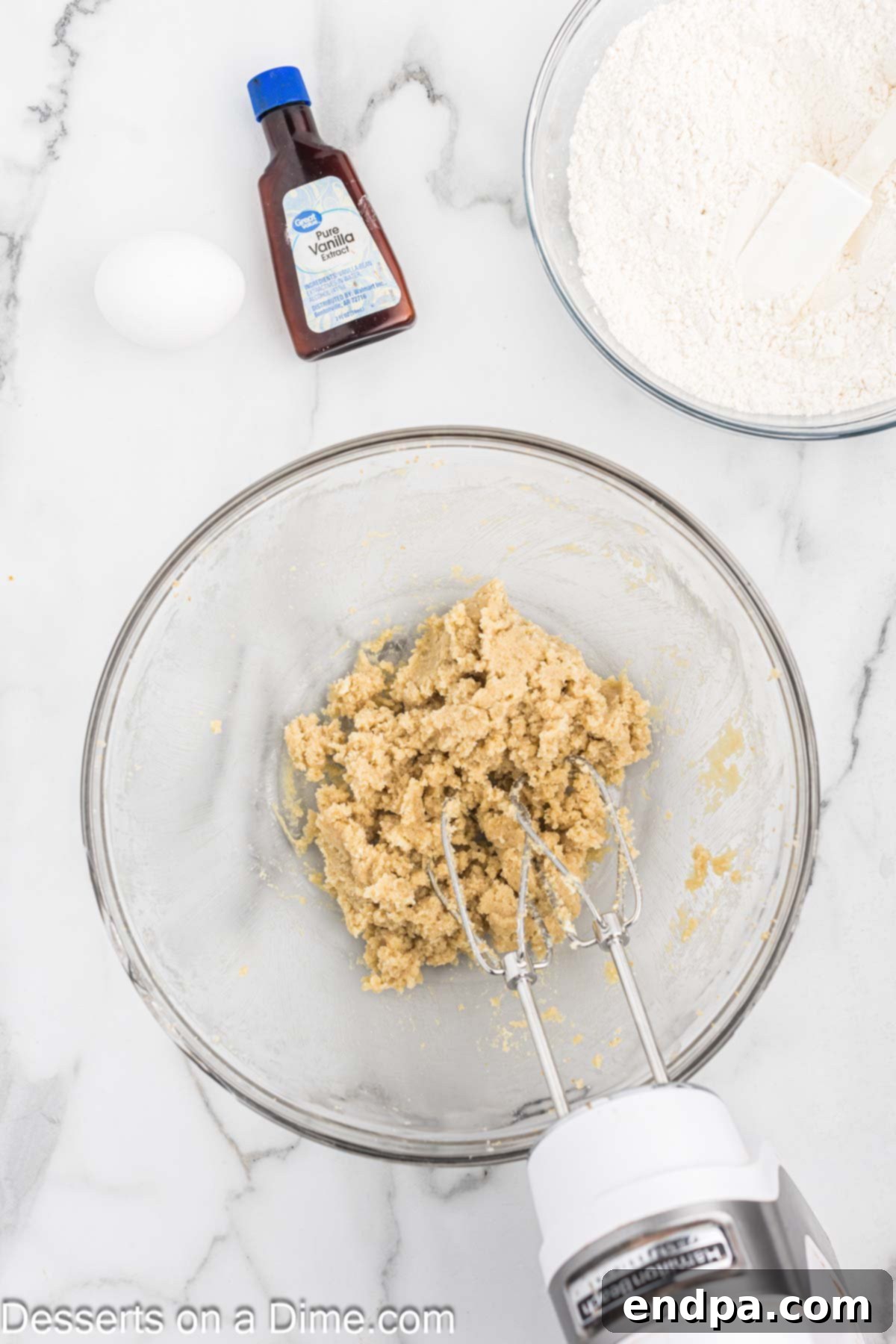 Butter and sugar creamed together in a bowl.