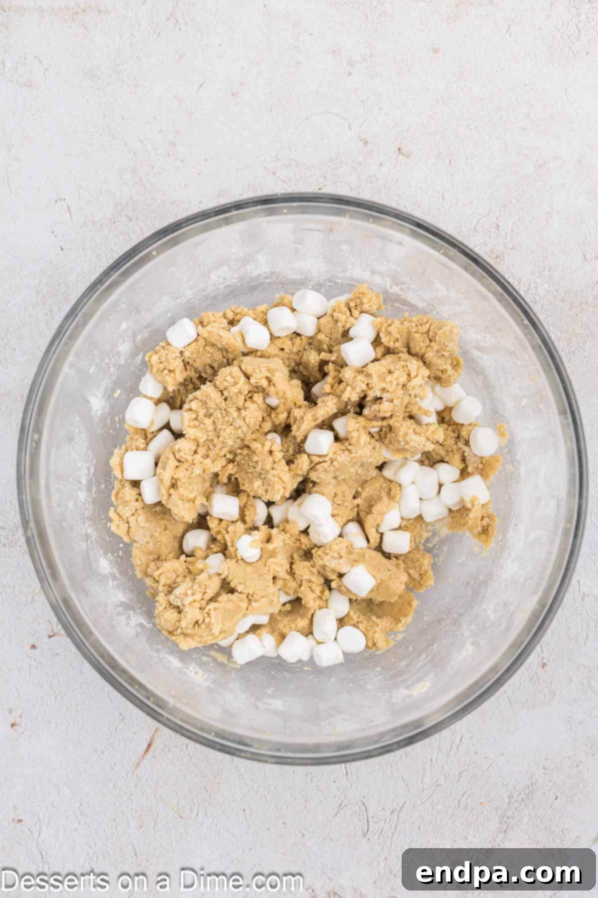 Fluffy Cloud Cookies 7 Mini marshmallows are gently folded into the prepared cookie dough batter.