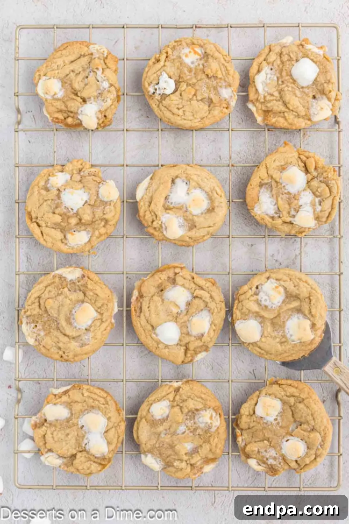 Fluffy Cloud Cookies 10 Baked Marshmallow Cookies resting on a wire cooling rack to cool completely.