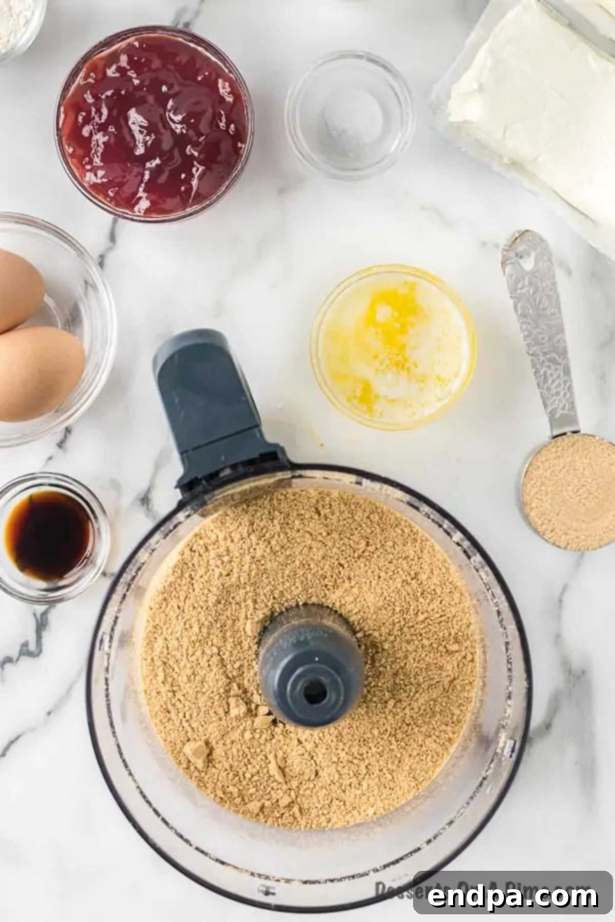 Decadent Raspberry Cheesecake Bars 4 Graham cracker crumbs in food processor.