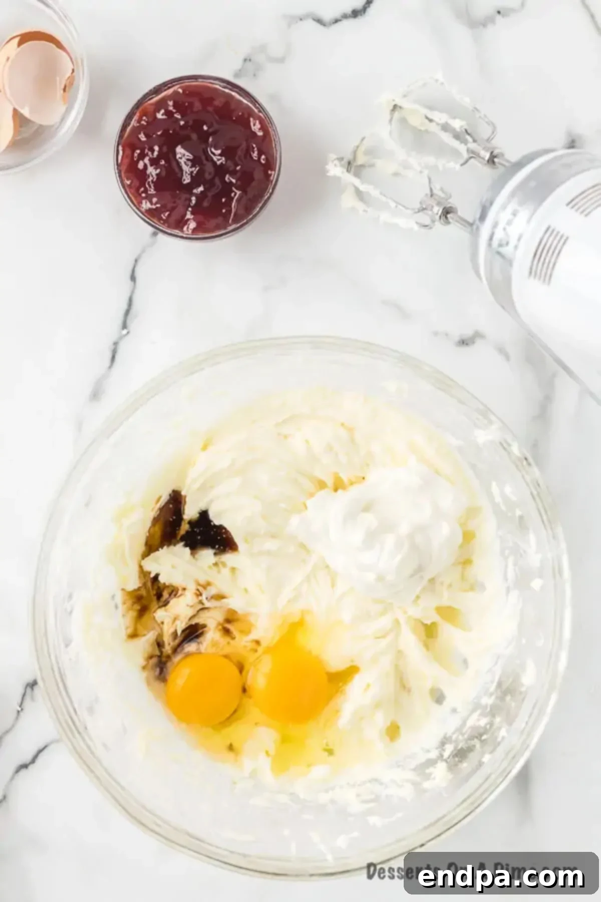 Decadent Raspberry Cheesecake Bars 7 Eggs and vanilla added to cream cheese mixture.