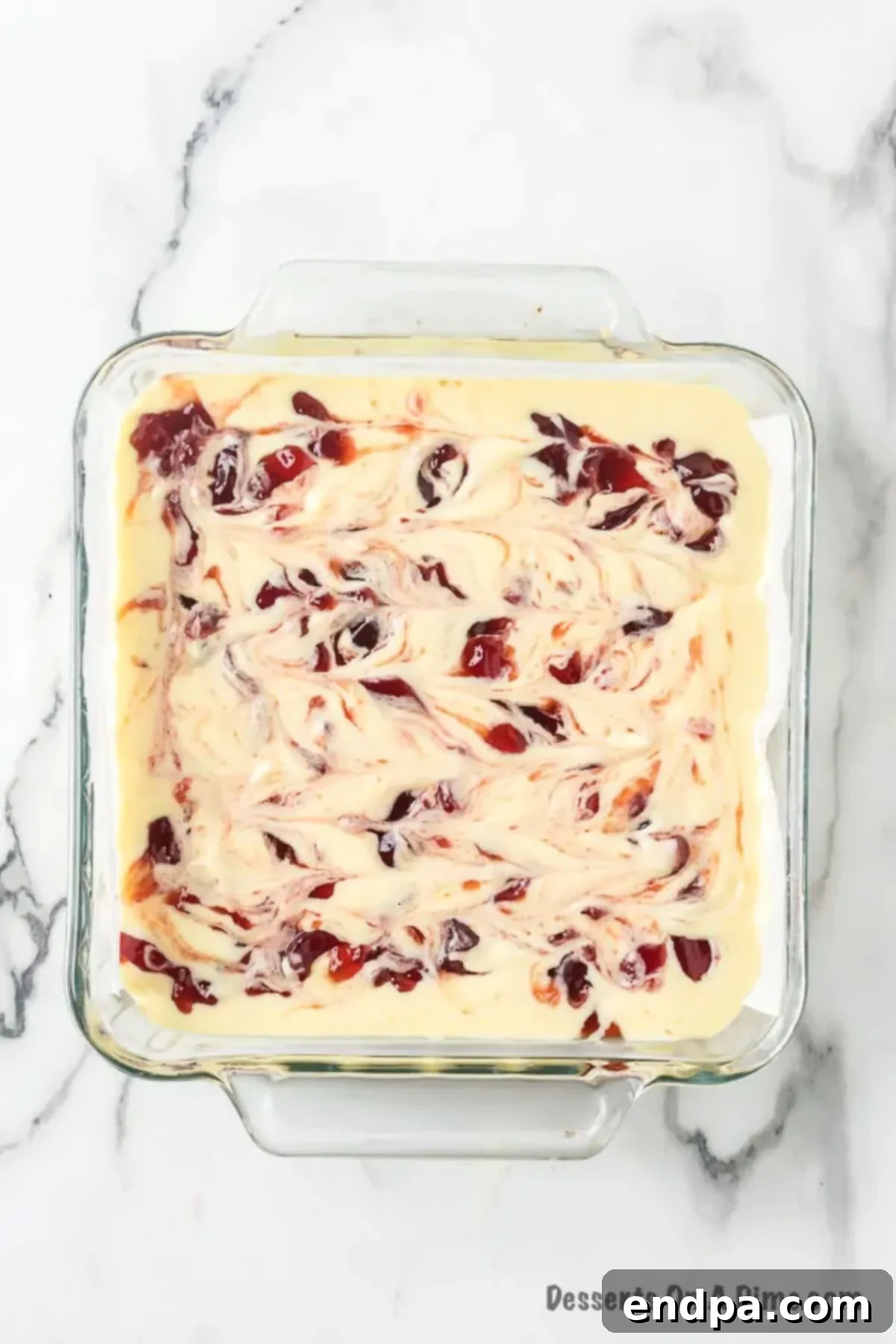 Decadent Raspberry Cheesecake Bars 9 Raspberry jelly swirled into mixture.