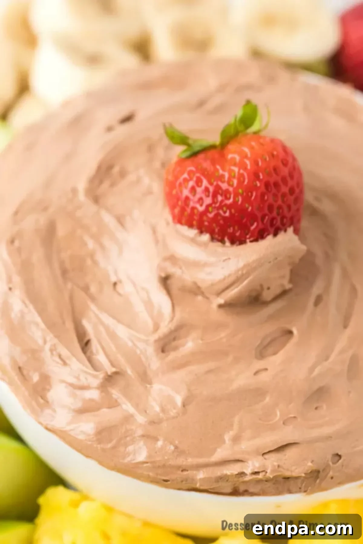 Sweet Chocolate Fruit Indulgence 2 A bowl of creamy chocolate fruit dip, ready to be served with an assortment of fresh fruits.